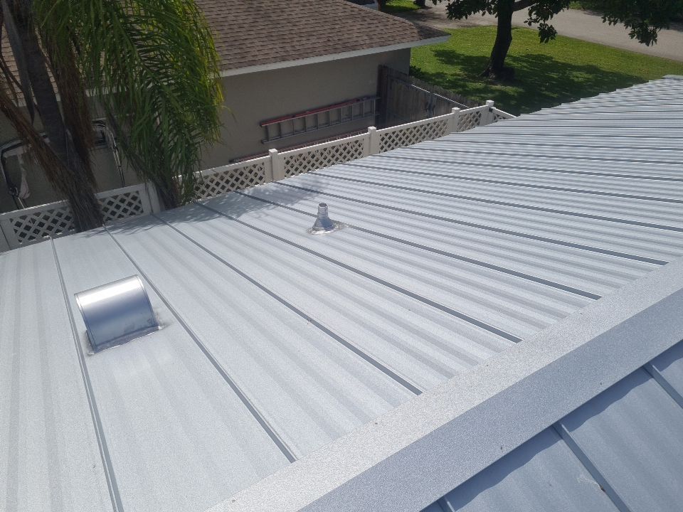 Residential Roofing Installation using 1" Nail strip metal roof by BLUES BROTHERS CONSTRUCTION CORP