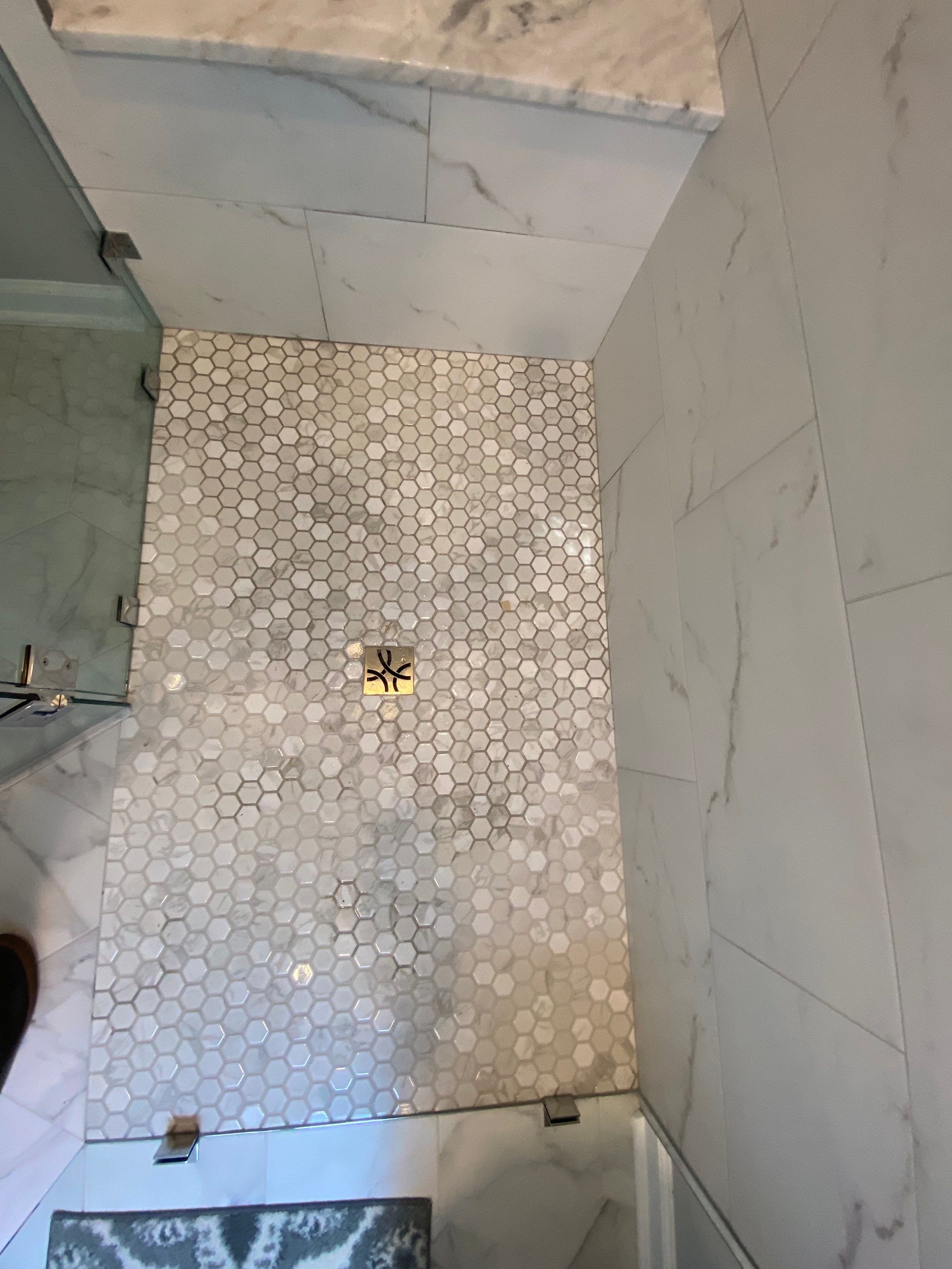 Luxury Bathroom Remodel with Marble Tiles in Kennesaw by Swift Home Renovations 