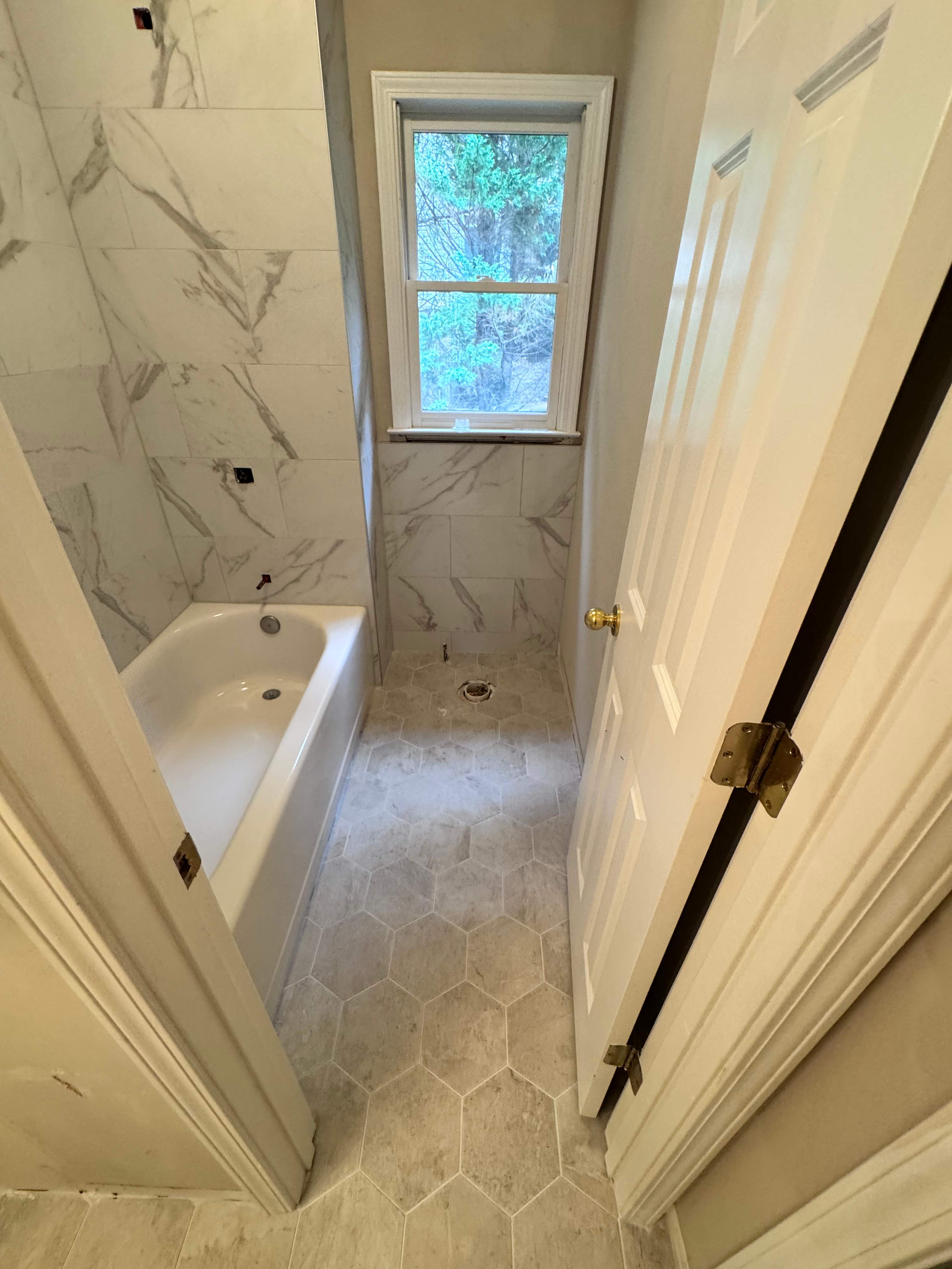 Tub and floor tile installation by Prudencio