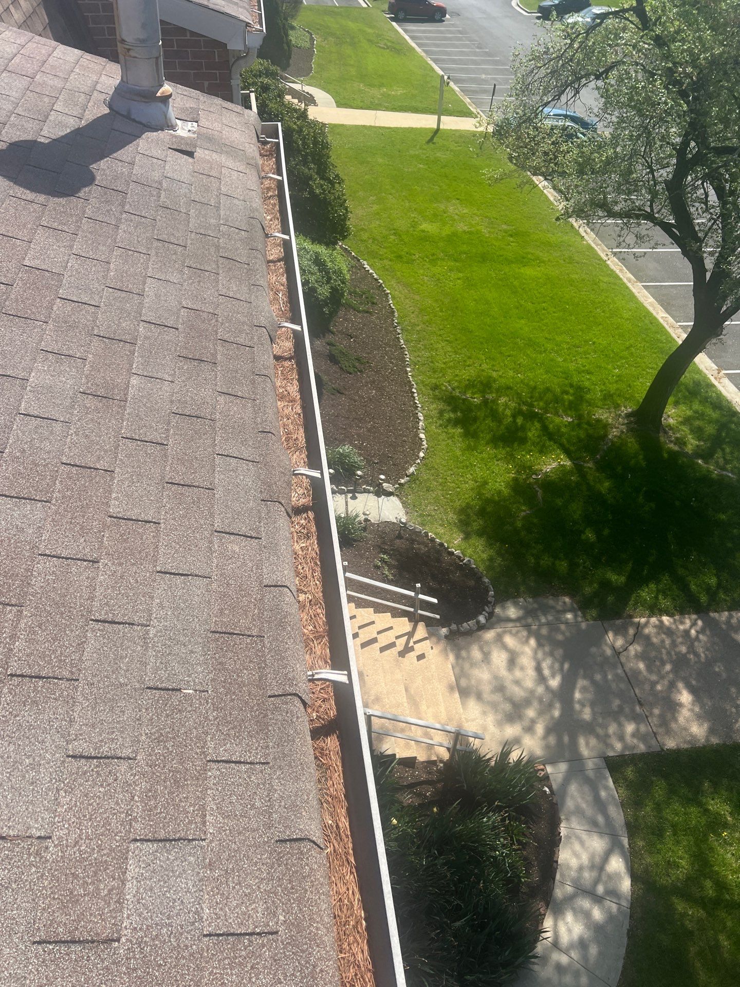 Commercial gutter cleaning Baltimore before photo with filled gutters