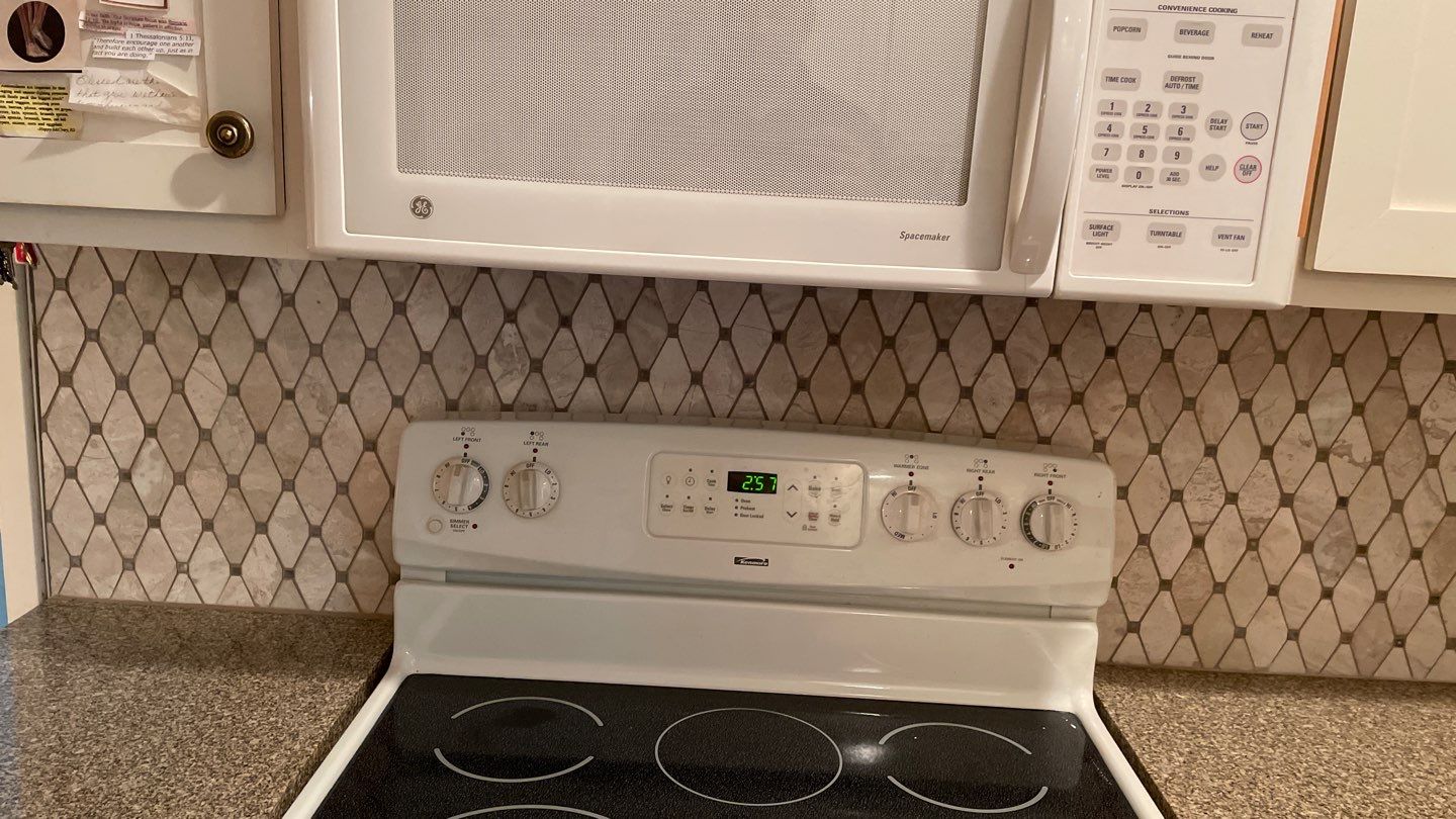 New Backsplash to Compliment the Countertops by Footprints Floors of Coastal Carolina