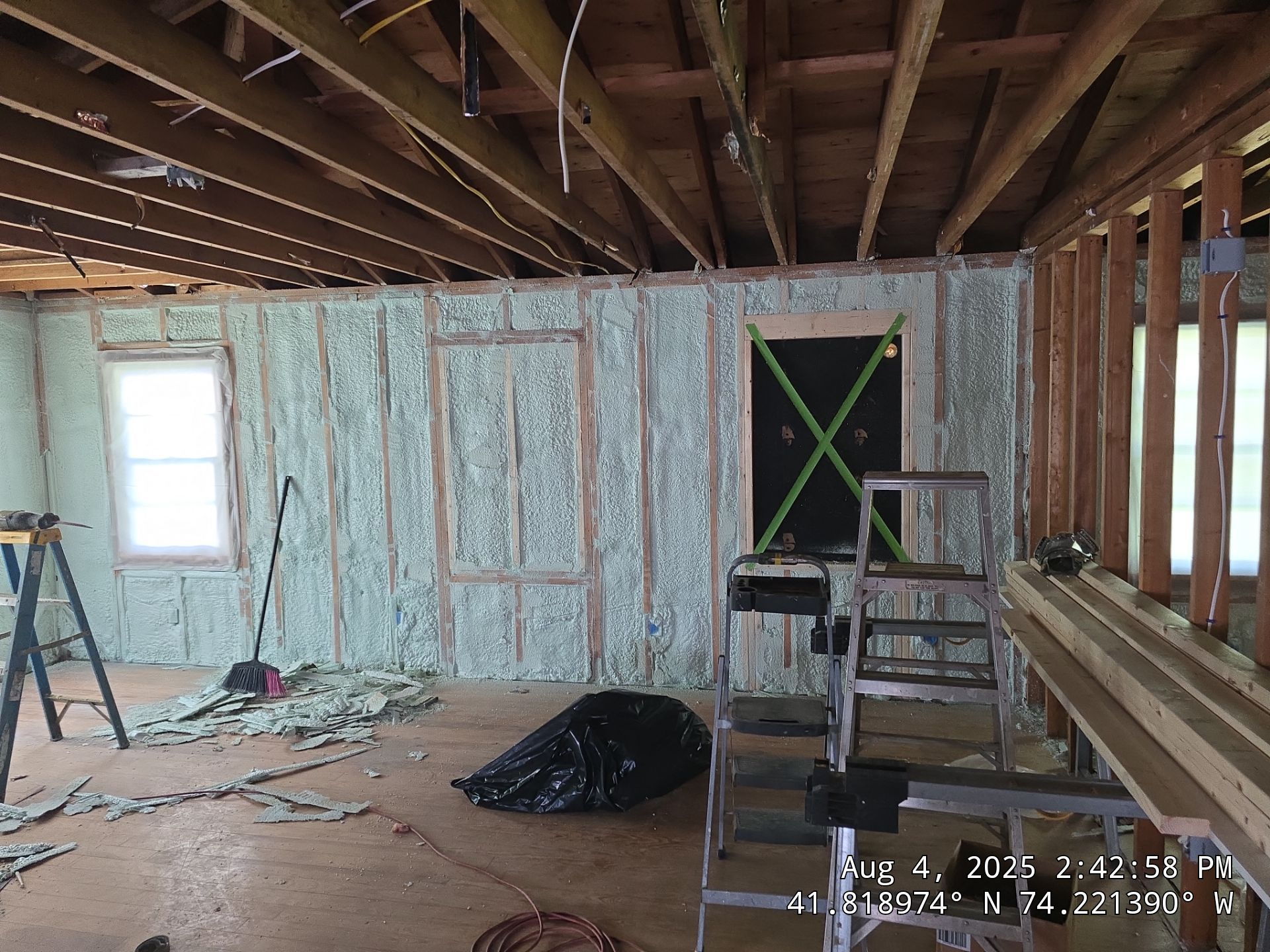 Master bedroom Exterior Walls using open cell spray foam by NYS Foam & Energy