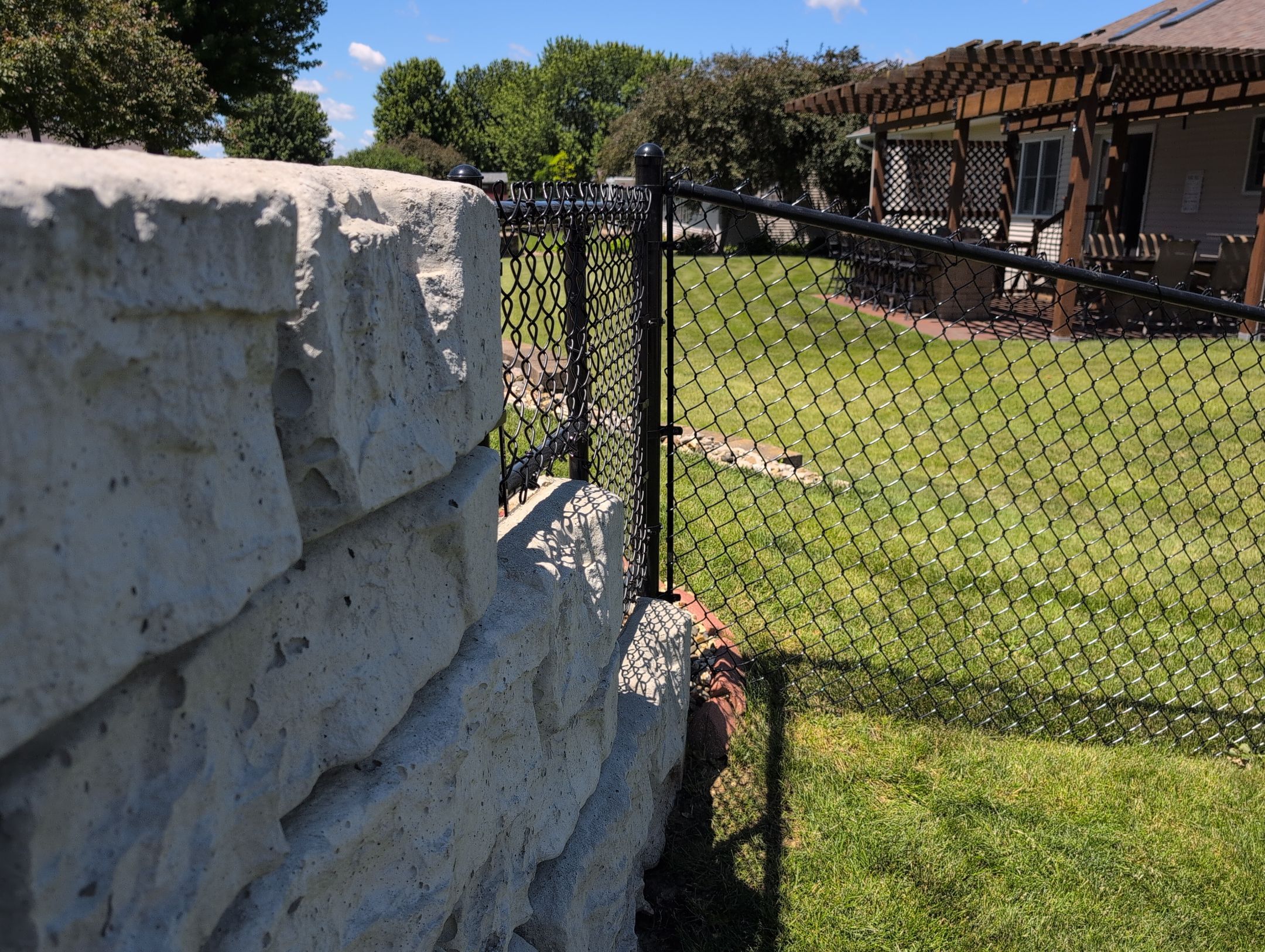 Black Vinyl-Coated Chain Link Fence Installation in Denver by Perfect Picket Fence and Stain