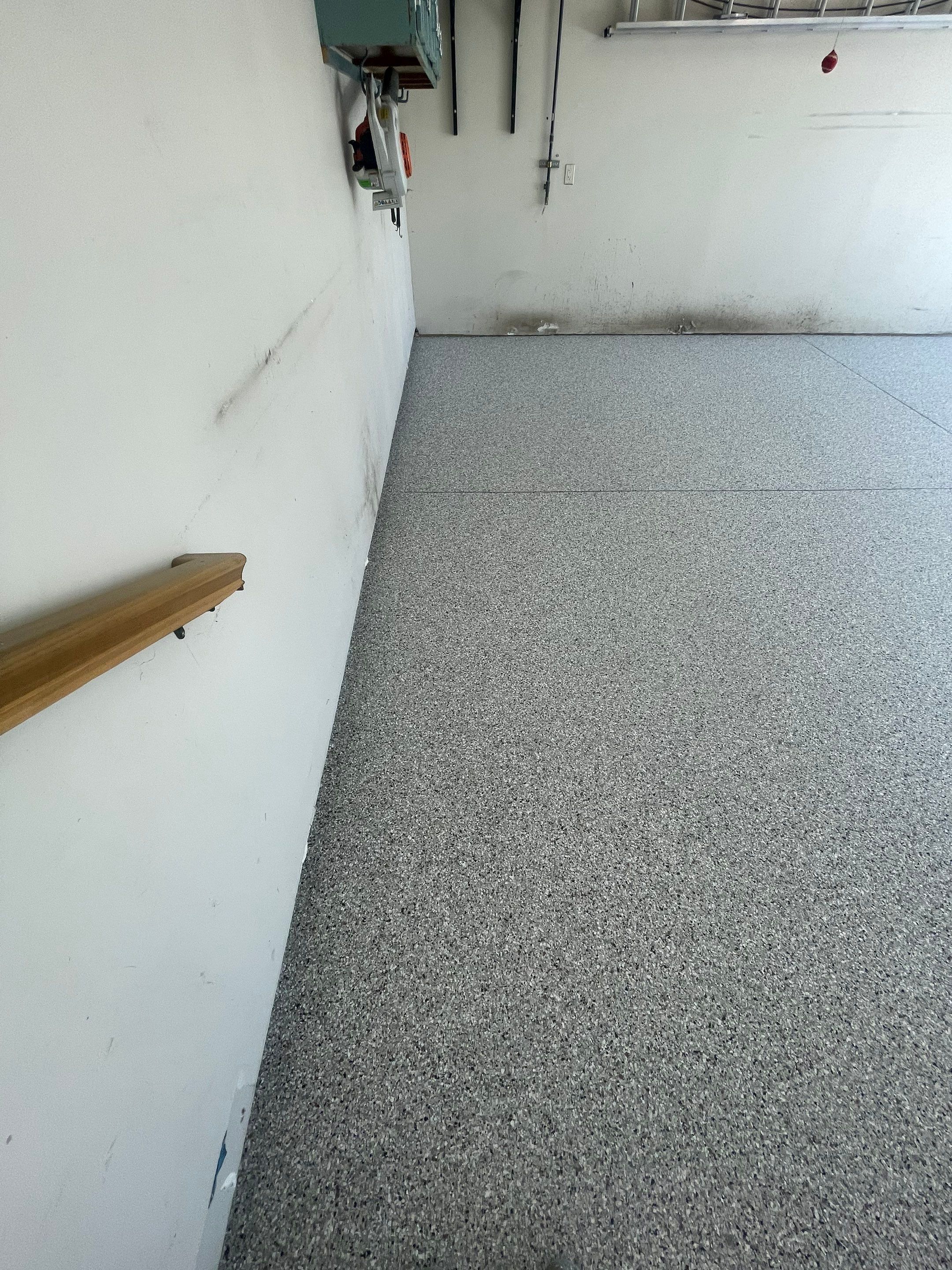 Multi-Stall Garage Floor Coating Installation in Sioux Falls by Select Painting, Coatings & Garage Cabinets
