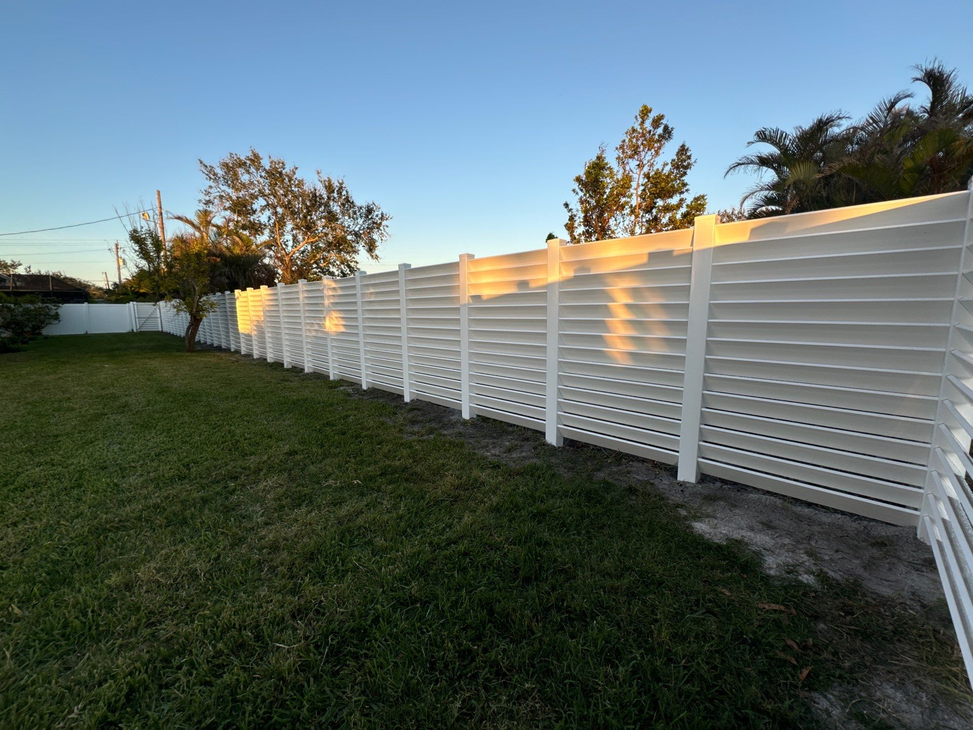 Louvered Vinyl Privacy Fence - White by Asap fence and gates, LLC