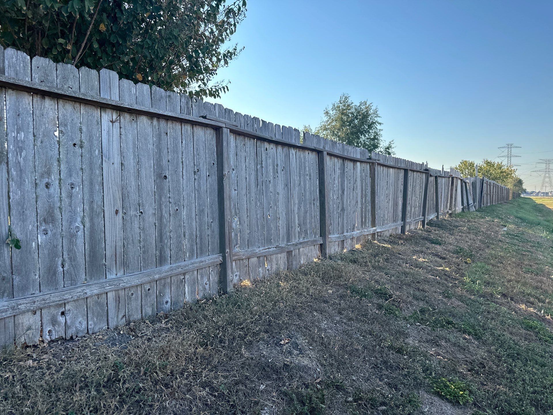 Beautiful Wood fence with metal posts by Tim's Fences