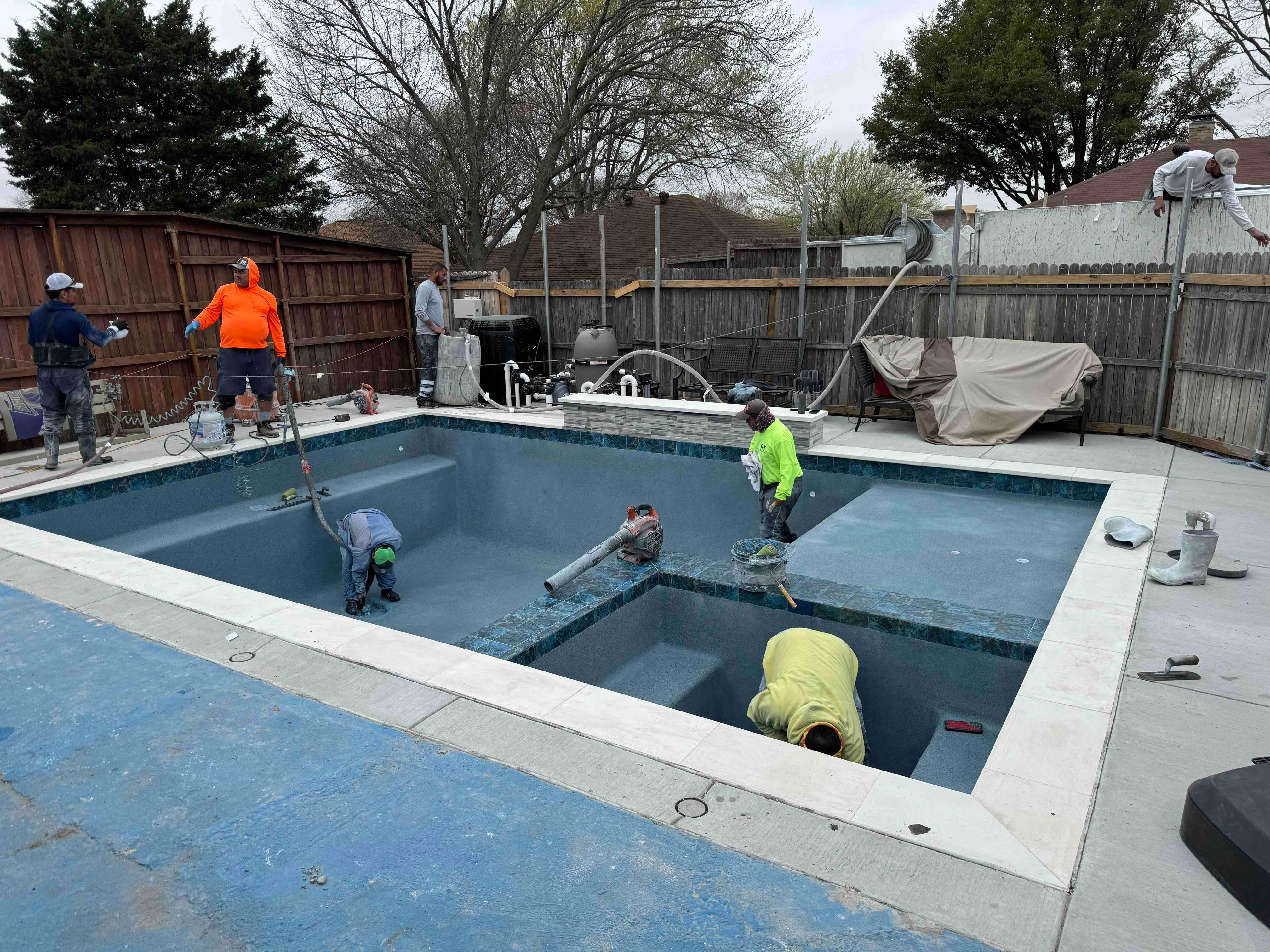 Geometric Pool with Raised Spa and Tanning Ledge by Pinnacle Pools and Spas - DFW