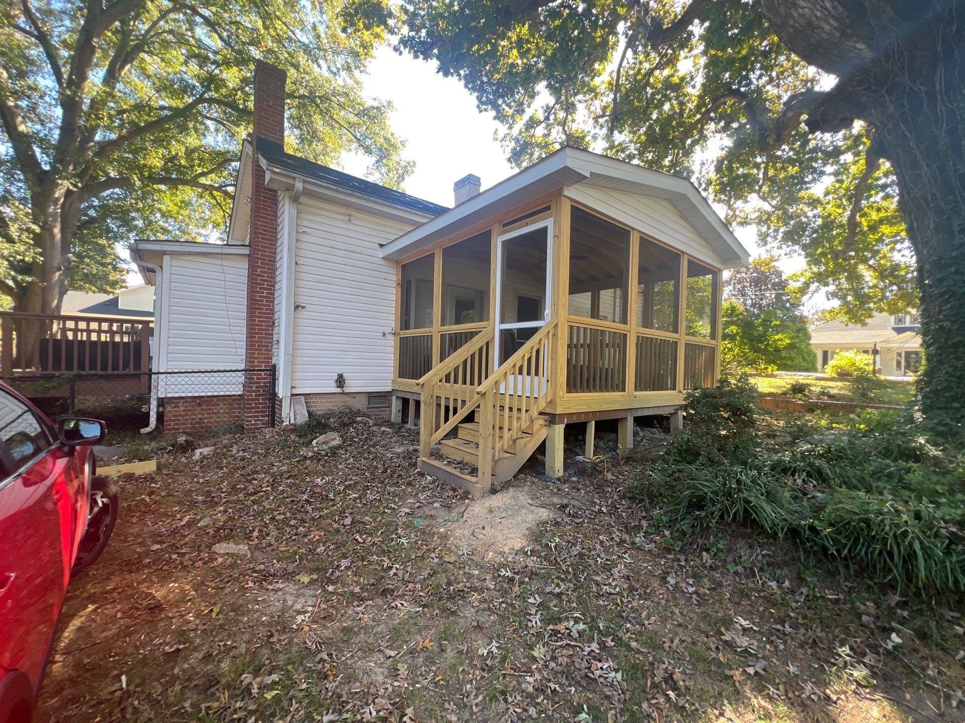 Custom Screened Porch Construction with Gable Roof in Apex by The Remodeling Company