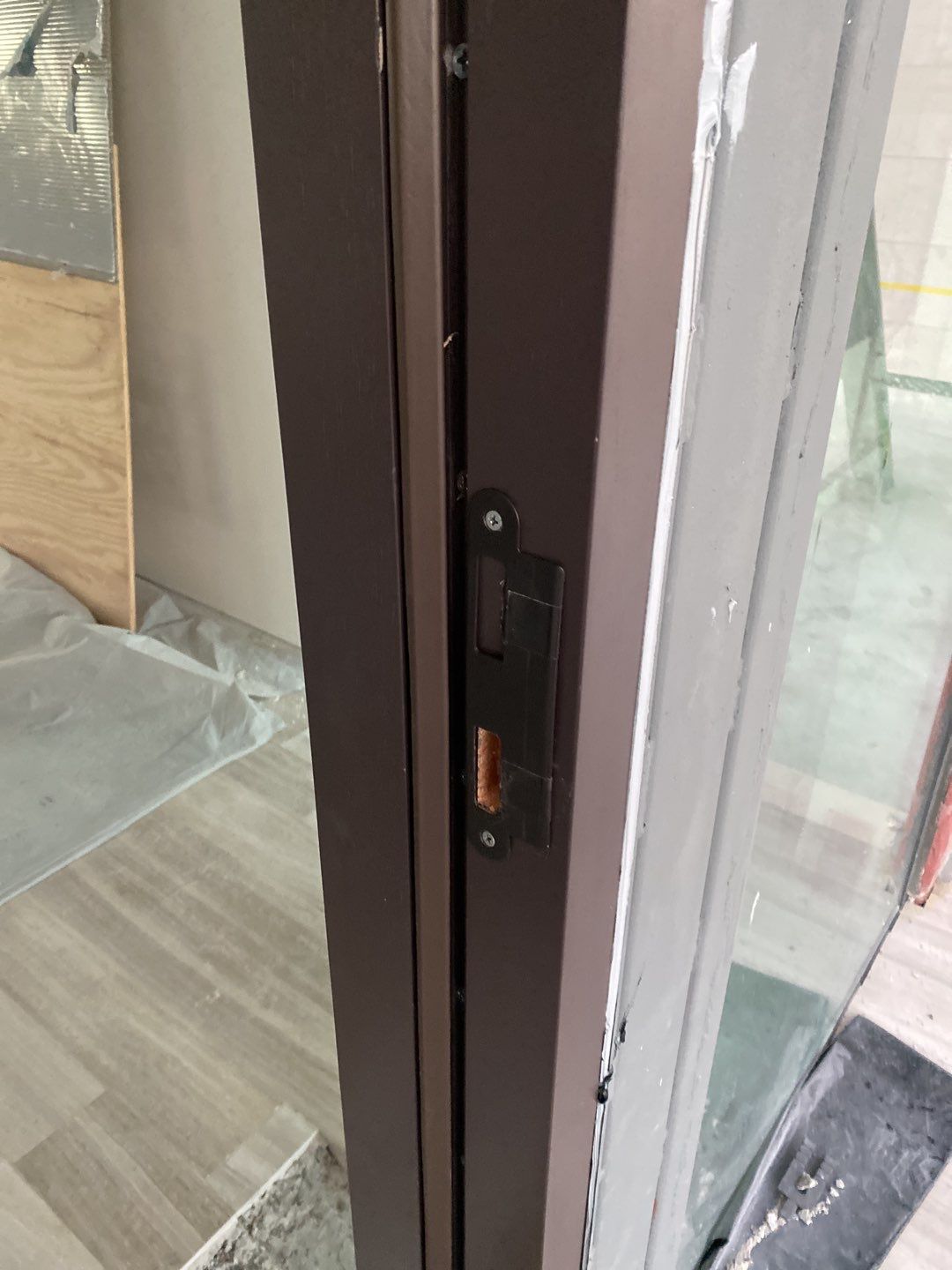 Custom Material Pivot Door installation by Impact Precious Wood Inc.