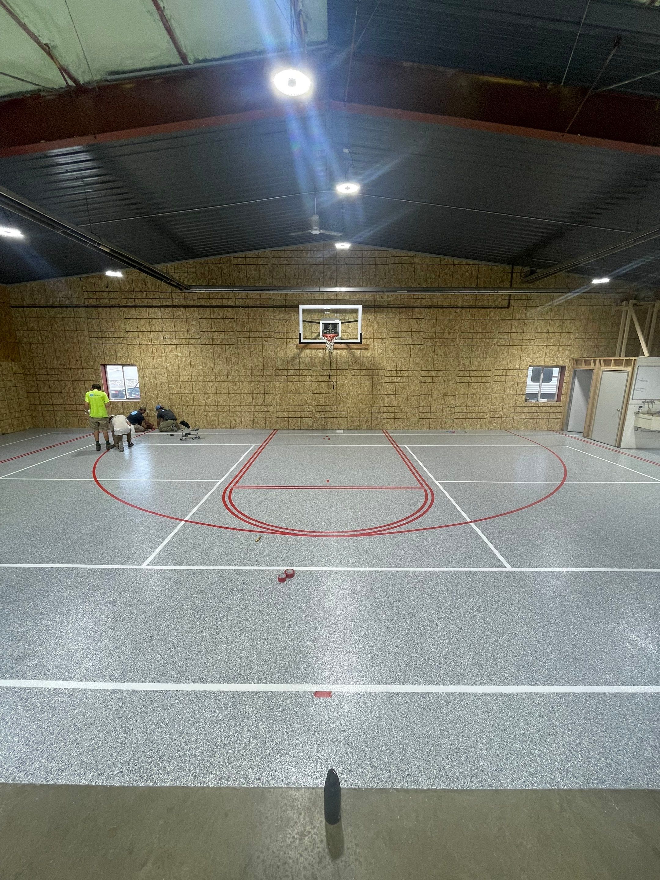 Custom Polyurea Shop Floor with Basketball Court Lines in Rock Valley by Select Painting, Coatings & Garage Cabinets
