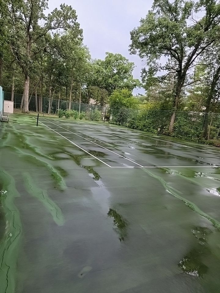 Tennis court cleaning by Northern Power Washing LLC.