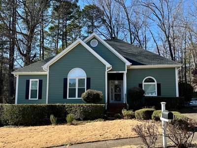 Raleigh Siding and Window Replacement with Custom Green Finish