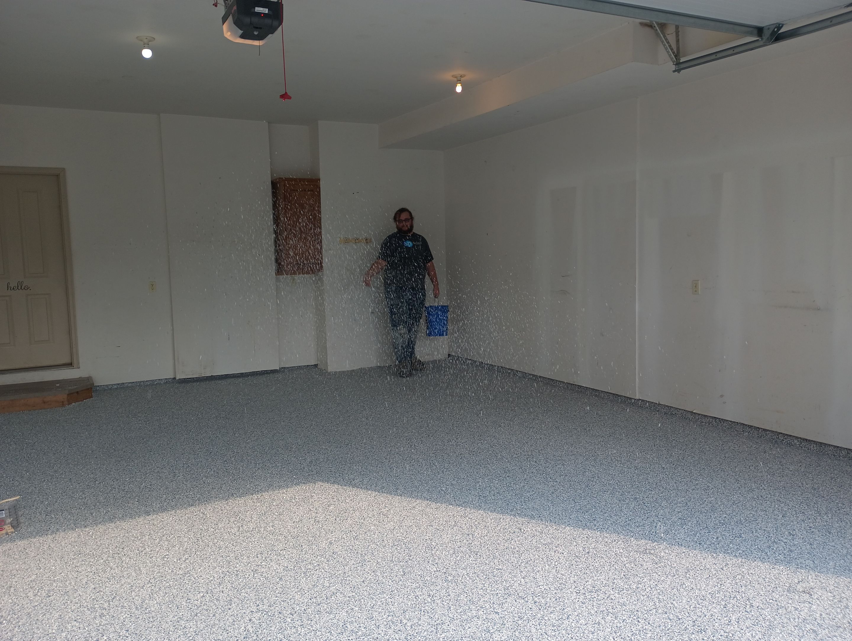Garage Concrete Coating Installation in Sioux Falls Using Tidal Wave Finish by Select Painting, Coatings & Garage Cabinets