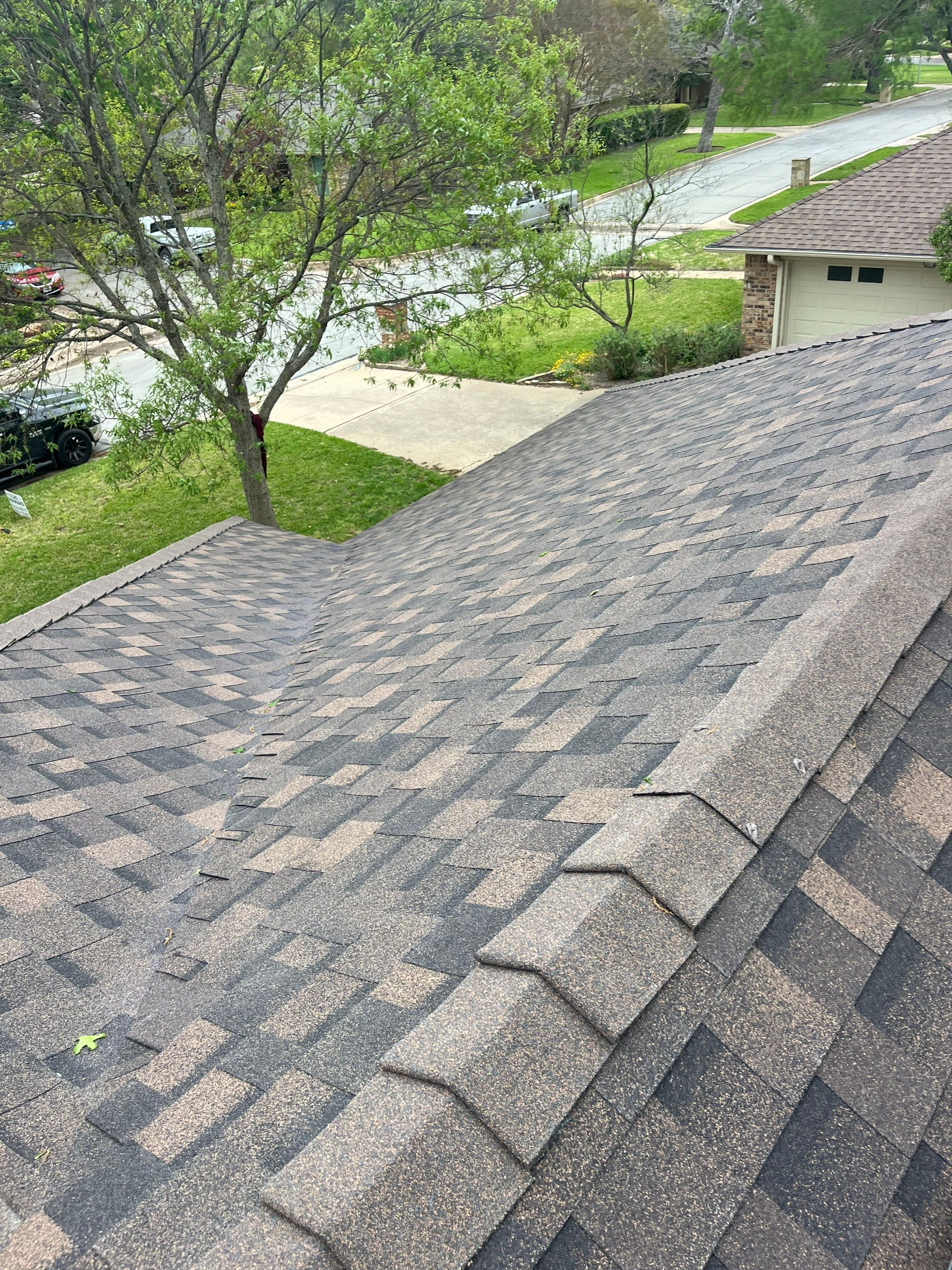Brown brick with IKO Shadow Brown by Tejas Roofworks + Restoration
