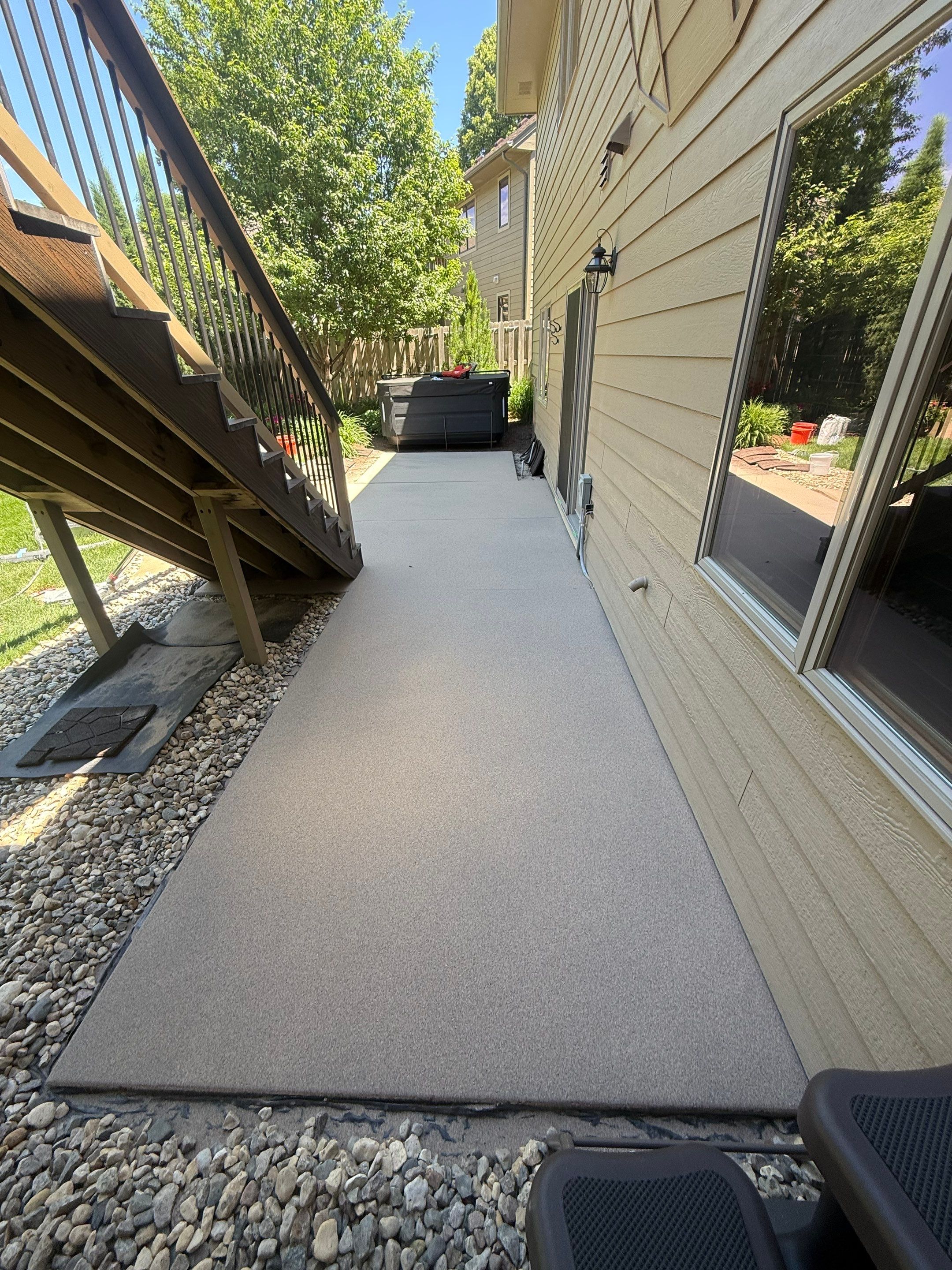 Textured Concrete Coating and Paver Patio Refresh in Sioux Falls by Select Painting, Coatings & Garage Cabinets