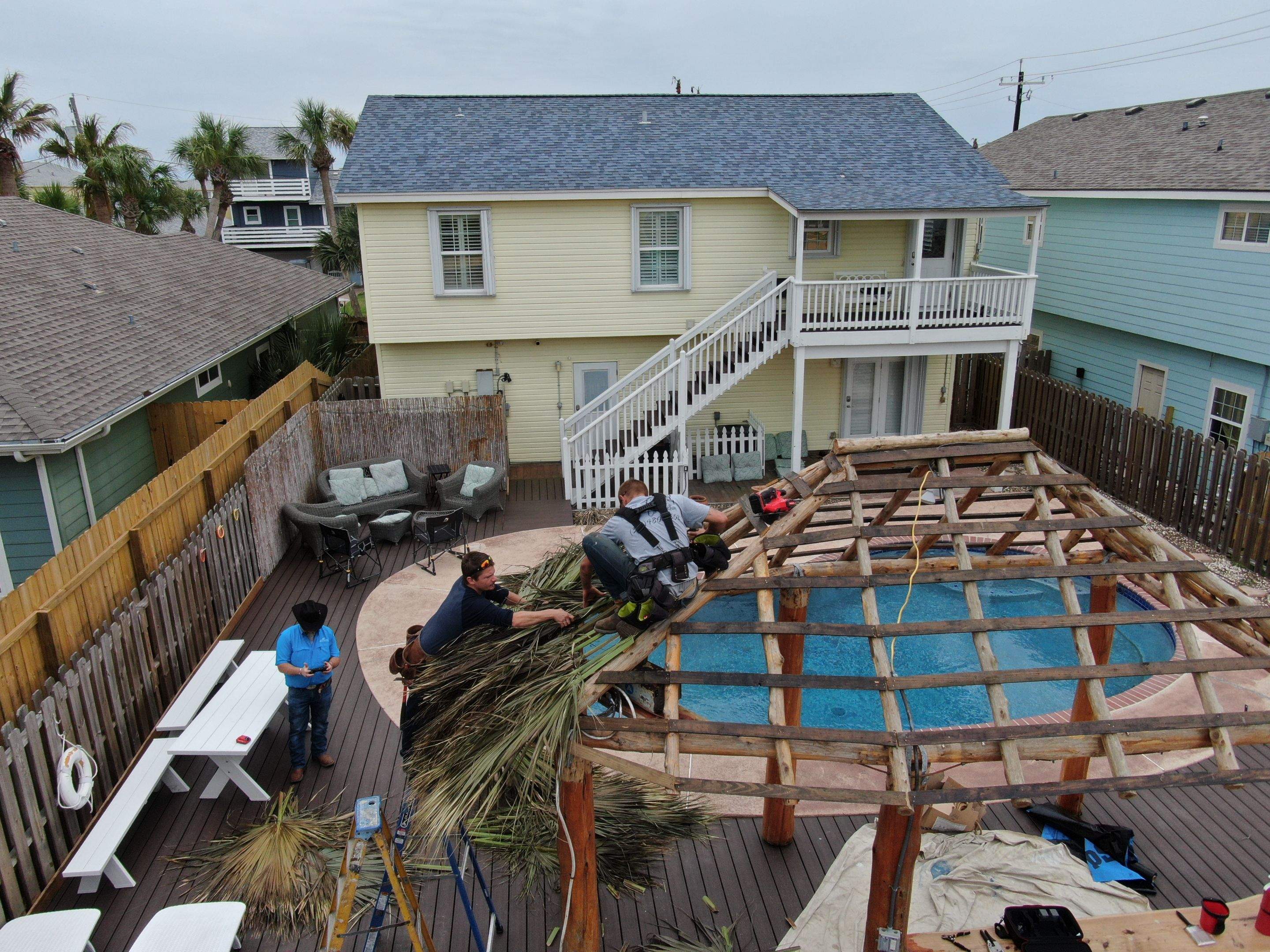 Poolside paradise by Bayfront Roofing and Construction