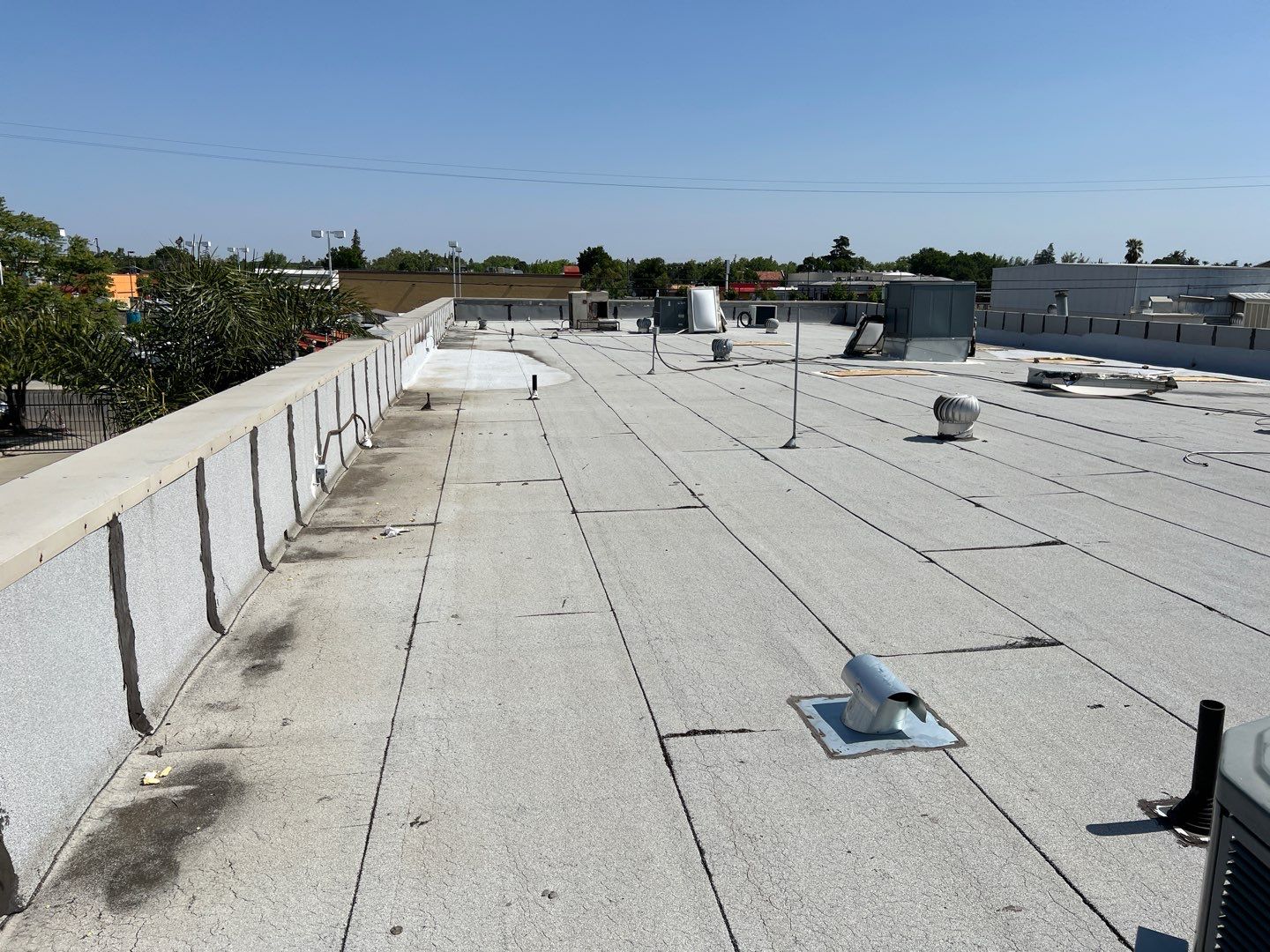 Spray foam and coatings using Conklin Benchmark/PUMA XL coatings and spray foam by Straight Edge Roofing Inc