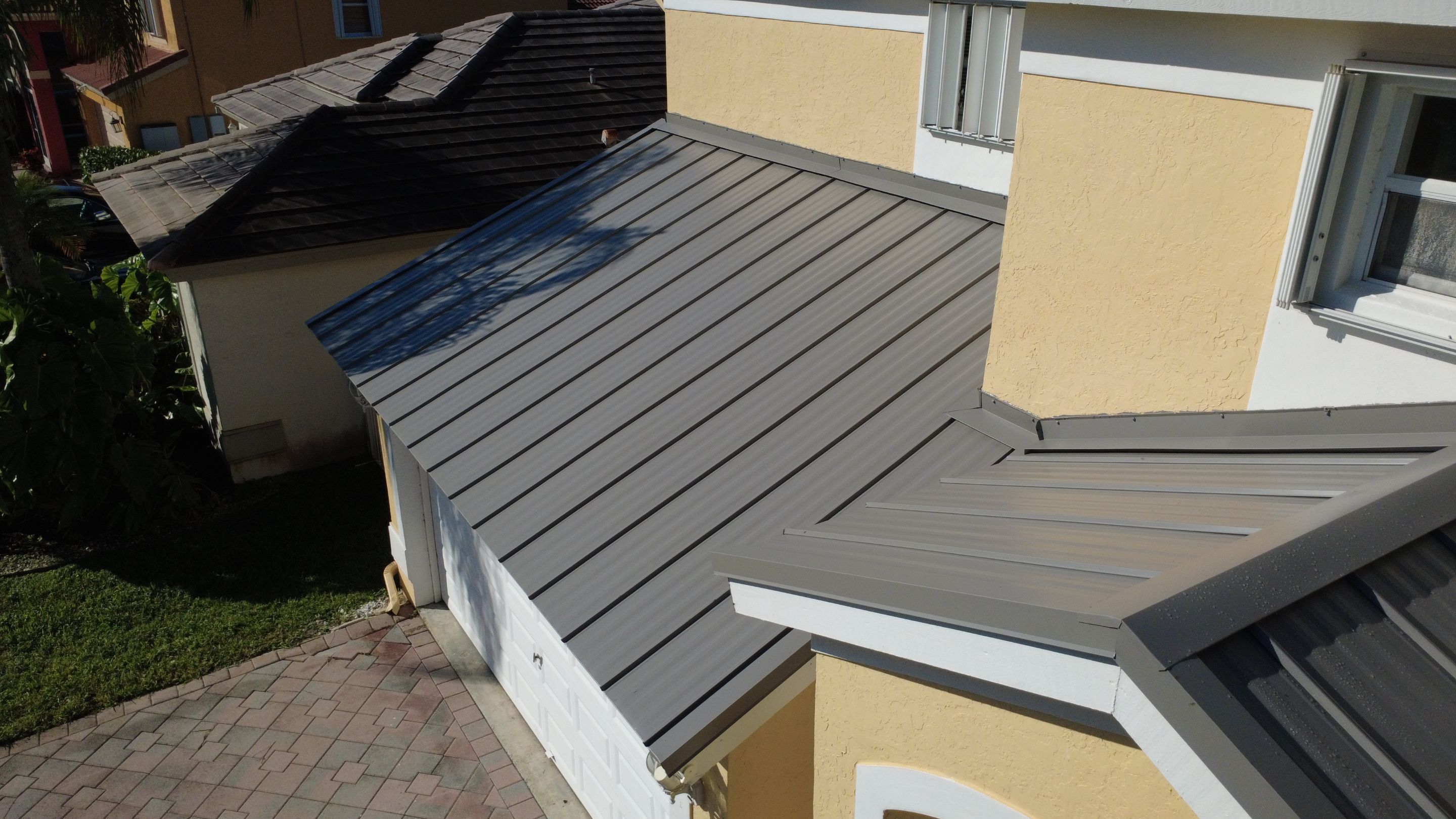 Residential Roofing Installation using 1" Nail strip metal roof by BLUES BROTHERS CONSTRUCTION CORP