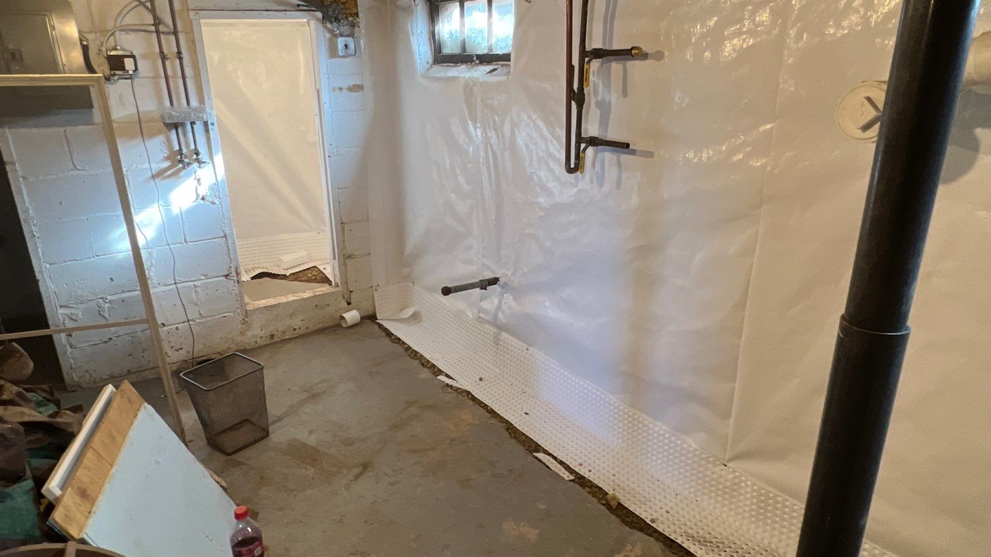 Basement Waterproofing using Drain tile system and a foundation wrap by ACE Waterproofing & Basement Solutions