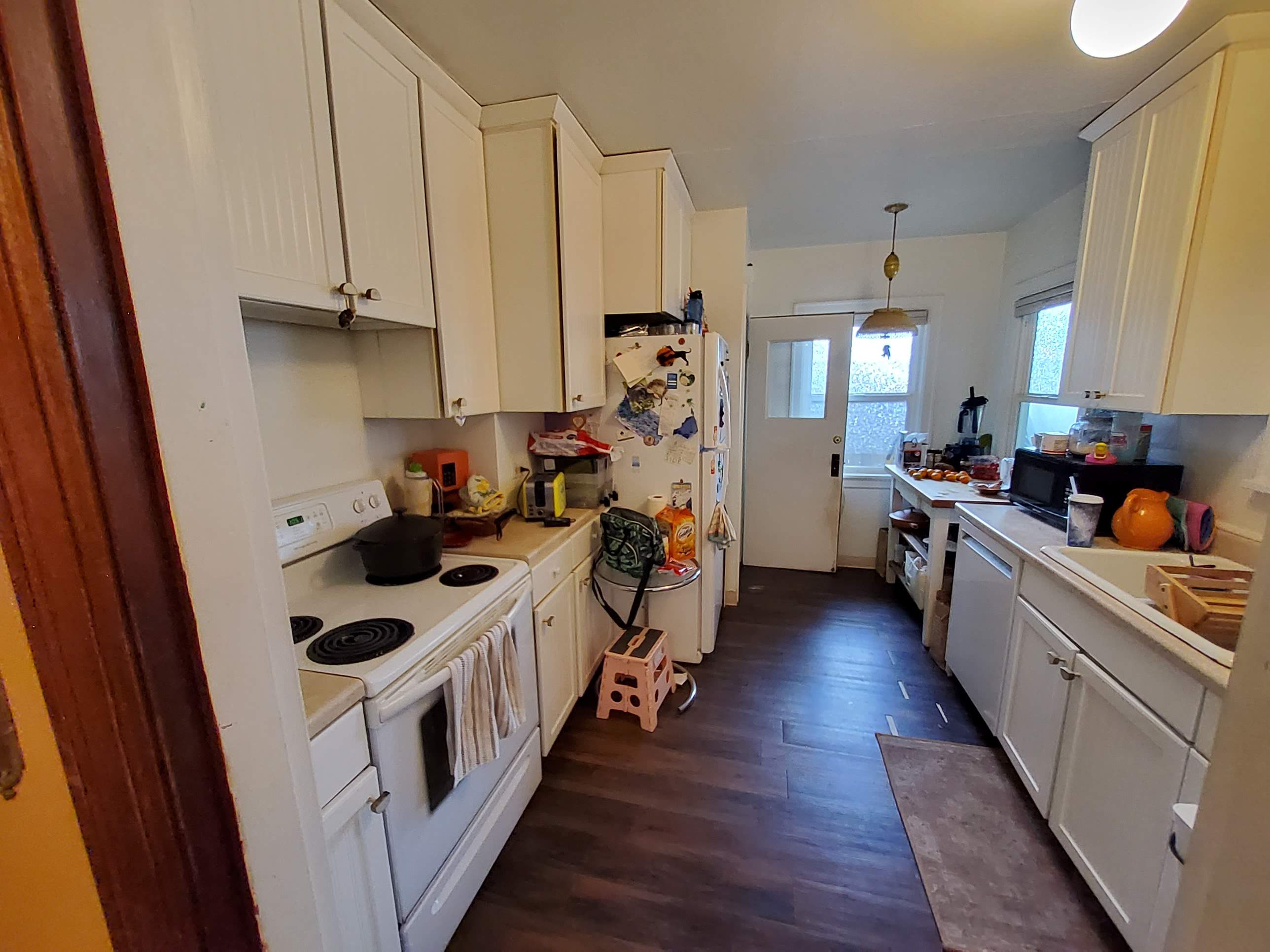 Complete Kitchen Remodeling Featuring Terracotta Tile and Wood Cabinetry by American Made Construction 