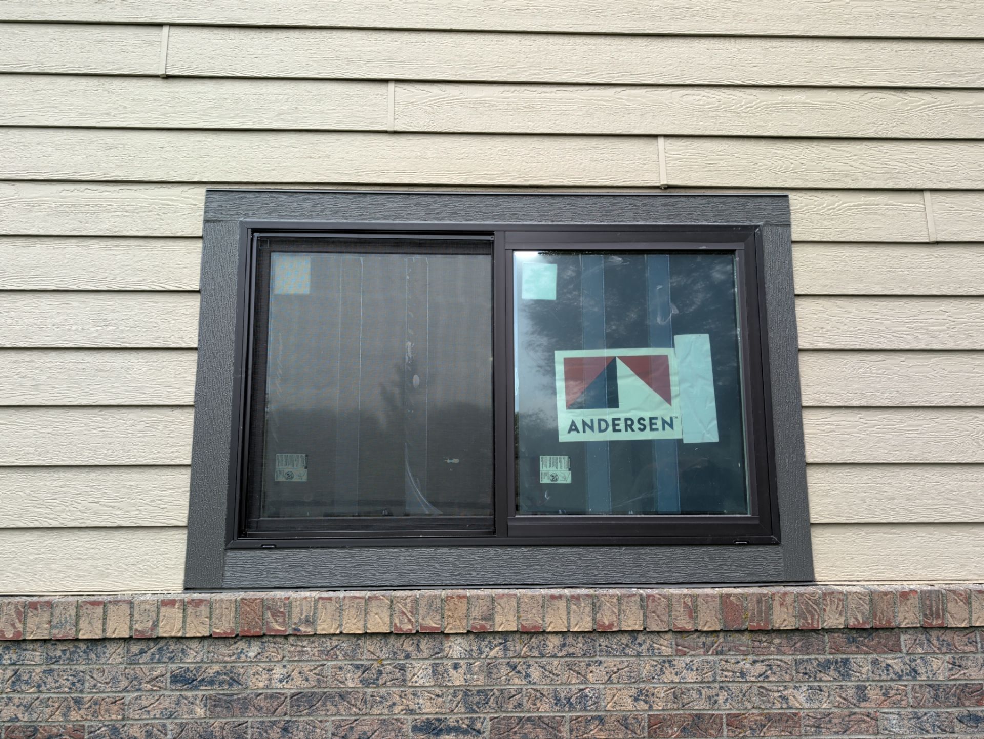 Yankton Garage Remodel with Andersen Window Installation and Drywall by Select Painting, Coatings & Garage Cabinets