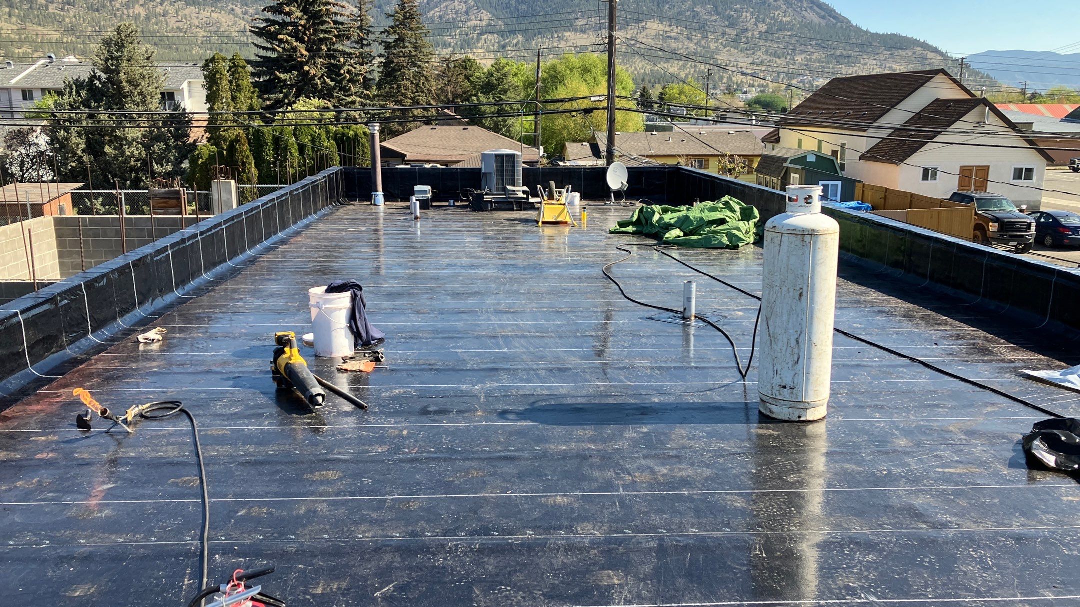 Commercial ReRoofing Installation using IKO 2ply sbs by Top Notch Roofing Inc