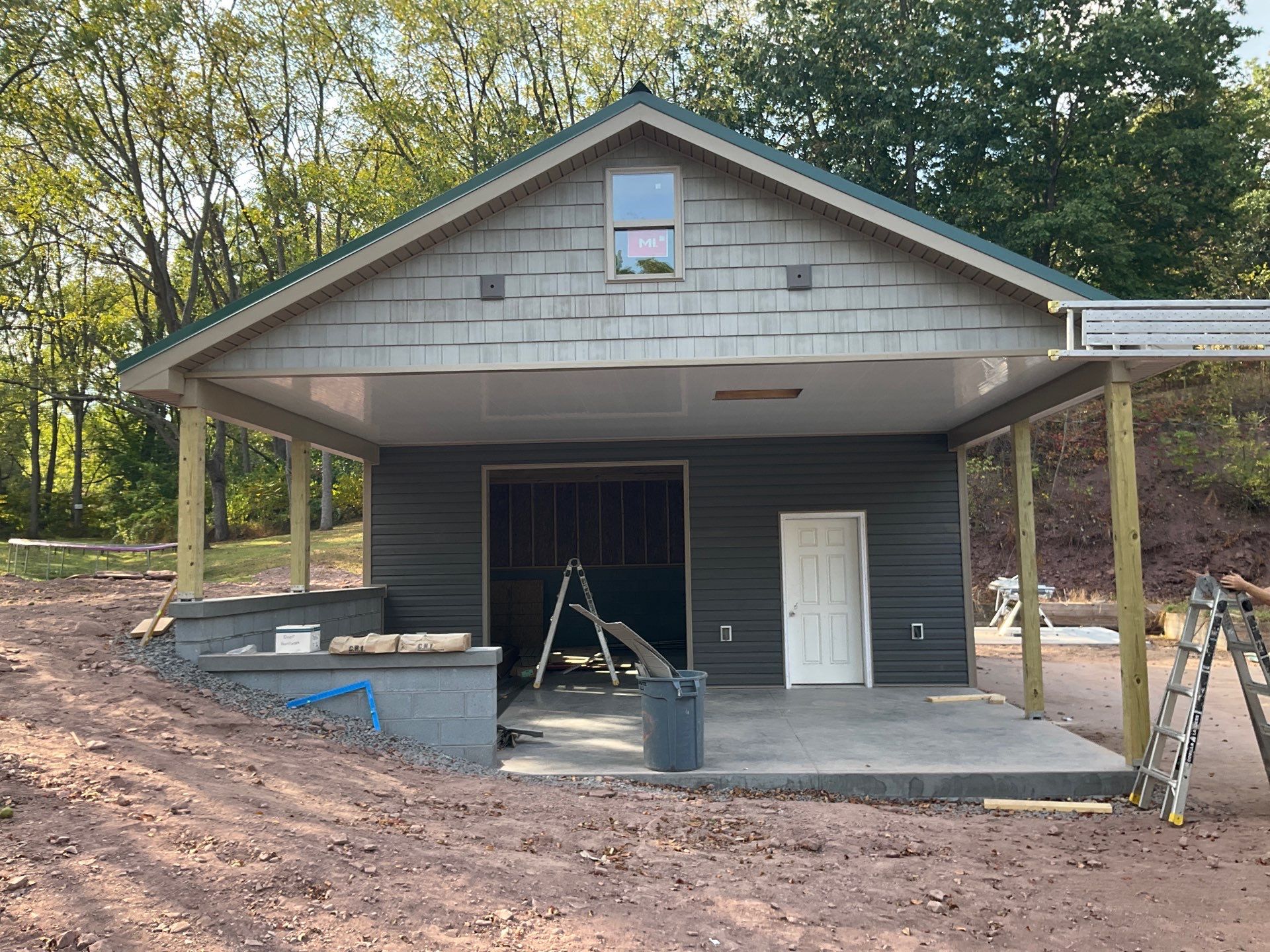 Detached Garage Construction with Vinyl Siding and Metal Roof by Esh Builders