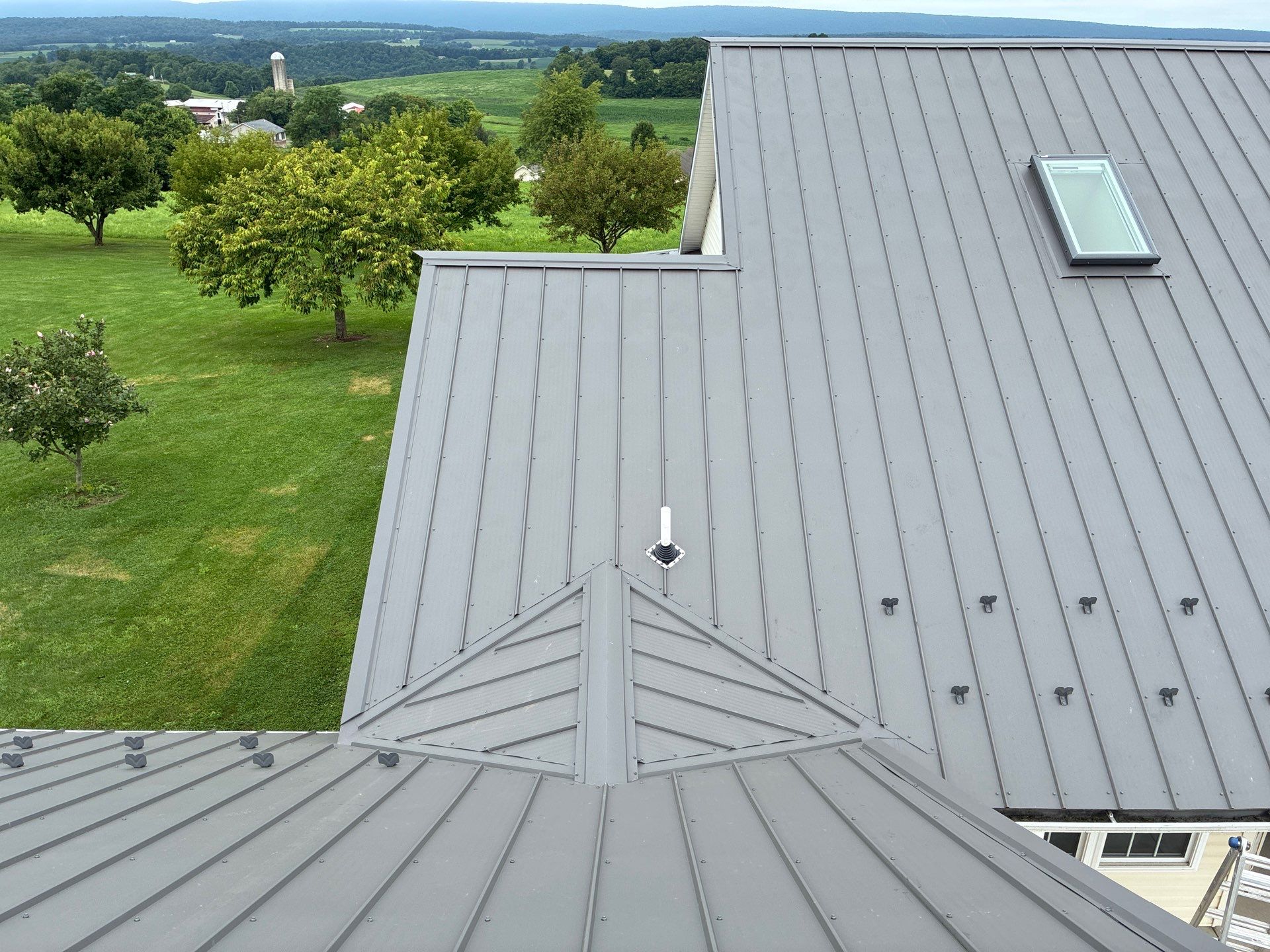 Newport Metal Roof Replacement with New Skylights by Esh Builders