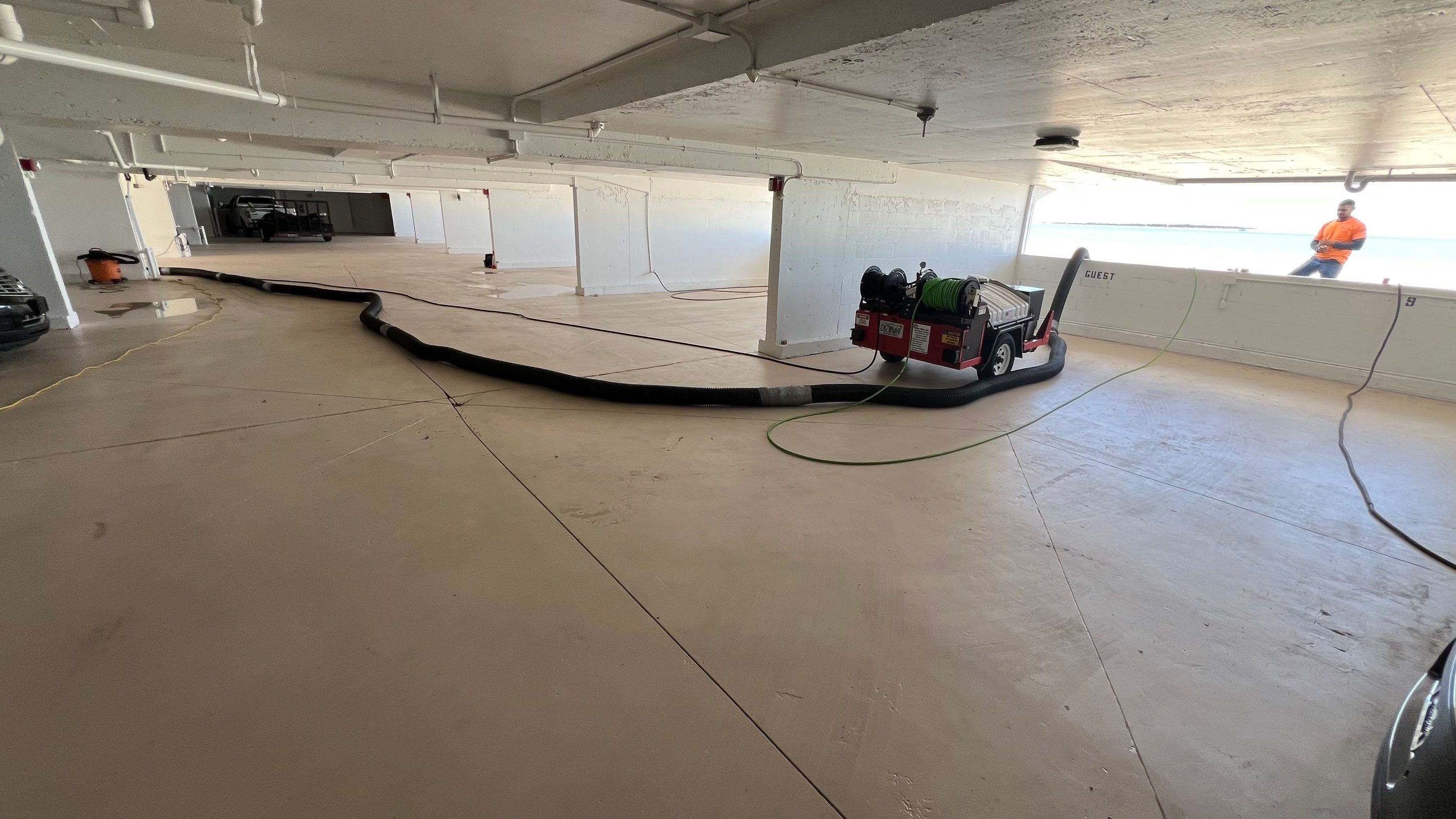 Isles of Capri Condo Parking Garage Drainage System Cleaning by APS Power & Water