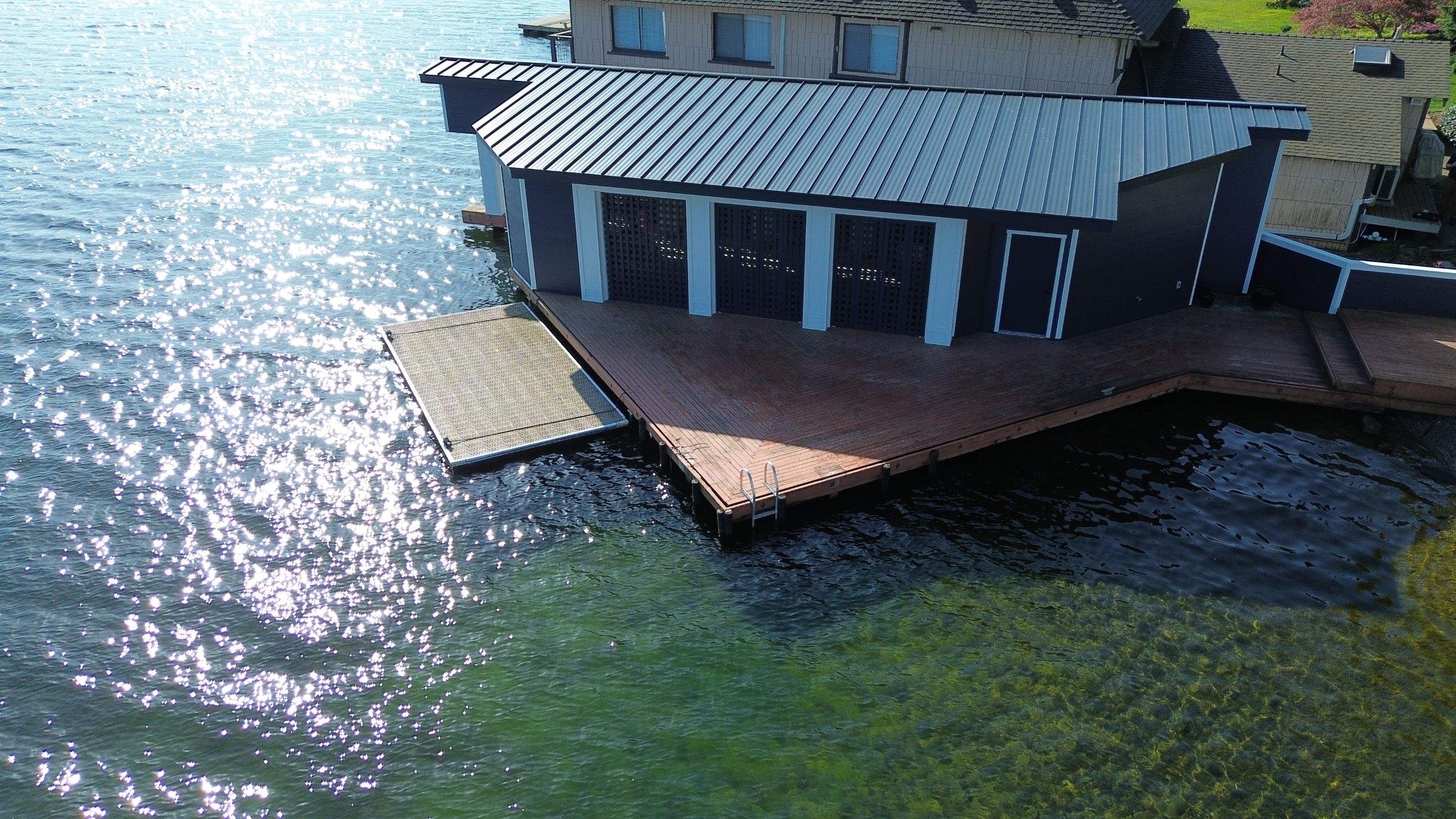 Boathouse roof and paint by RoofWorks Northwest