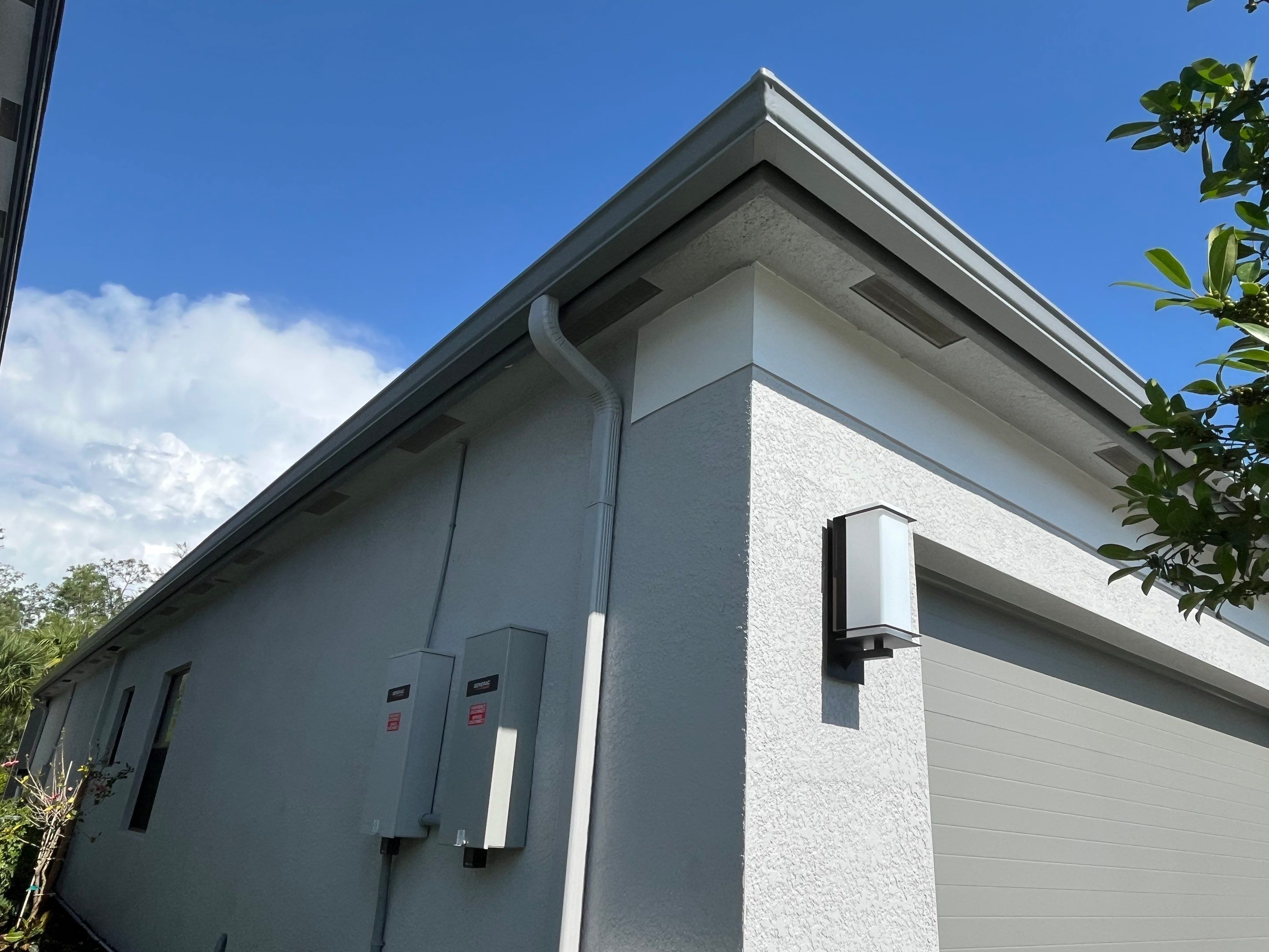 Grey Seamless Gutter Installation in Estero FL by Gutter Professors