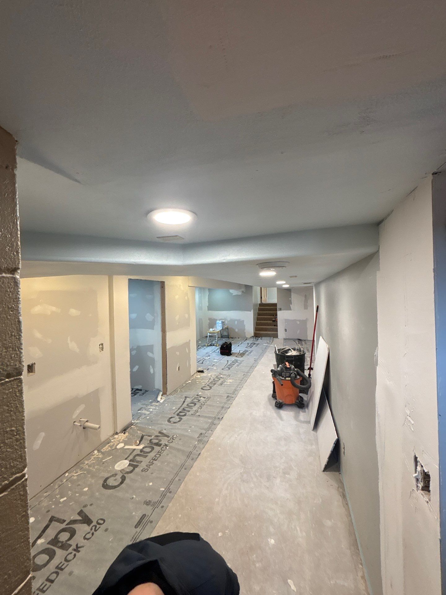 High-Gloss Epoxy Floor Coating and Basement Renovation in Rock Rapids by Select Painting, Coatings & Garage Cabinets