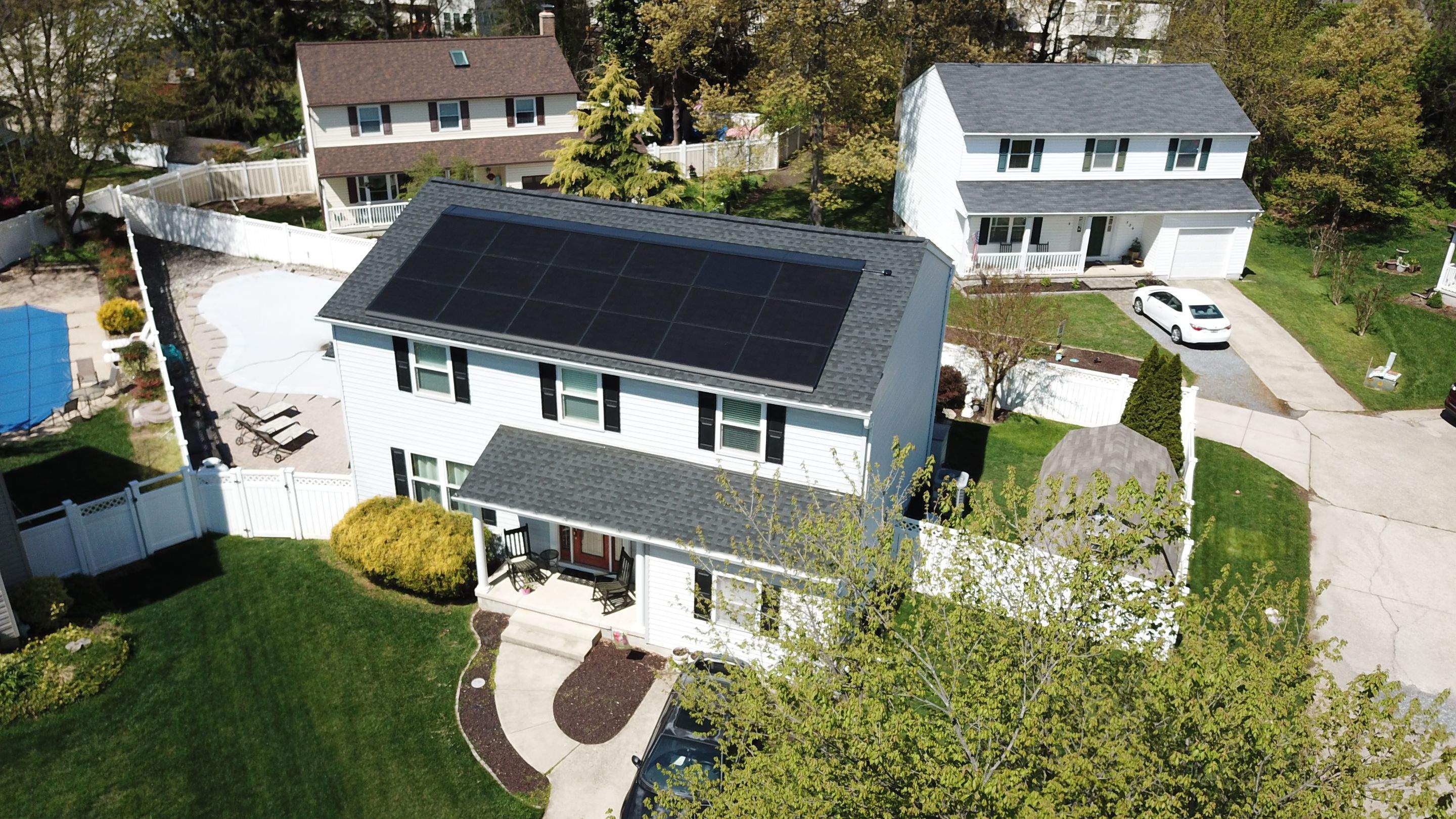 Roof Replacement with GAF Decotech integrated solar panels by American Home Contractors