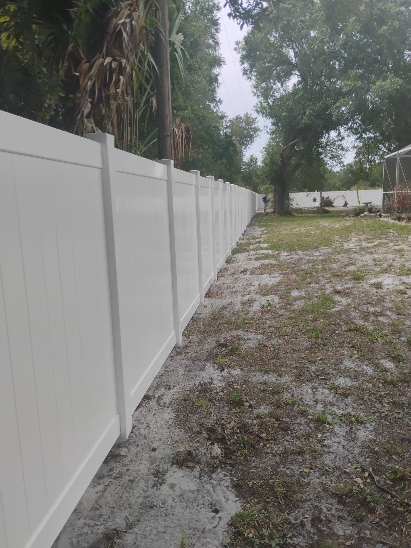 White Vinyl Privacy Fence Installation and Gate Assembly in Punta Gorda by True Fence LLC