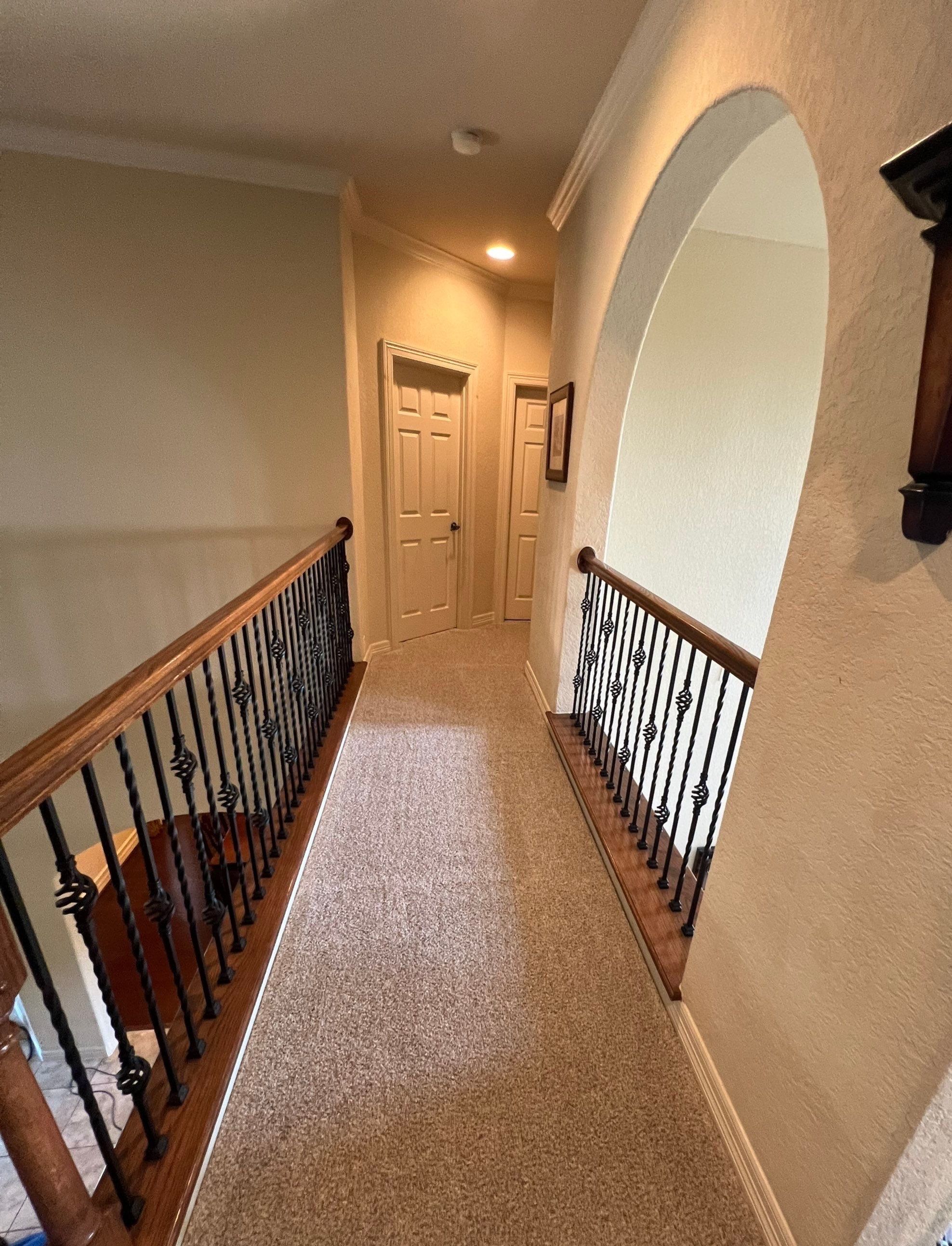 carpet cleaning service is in progress on the hallway carpet creating a fresh and appealing surface.