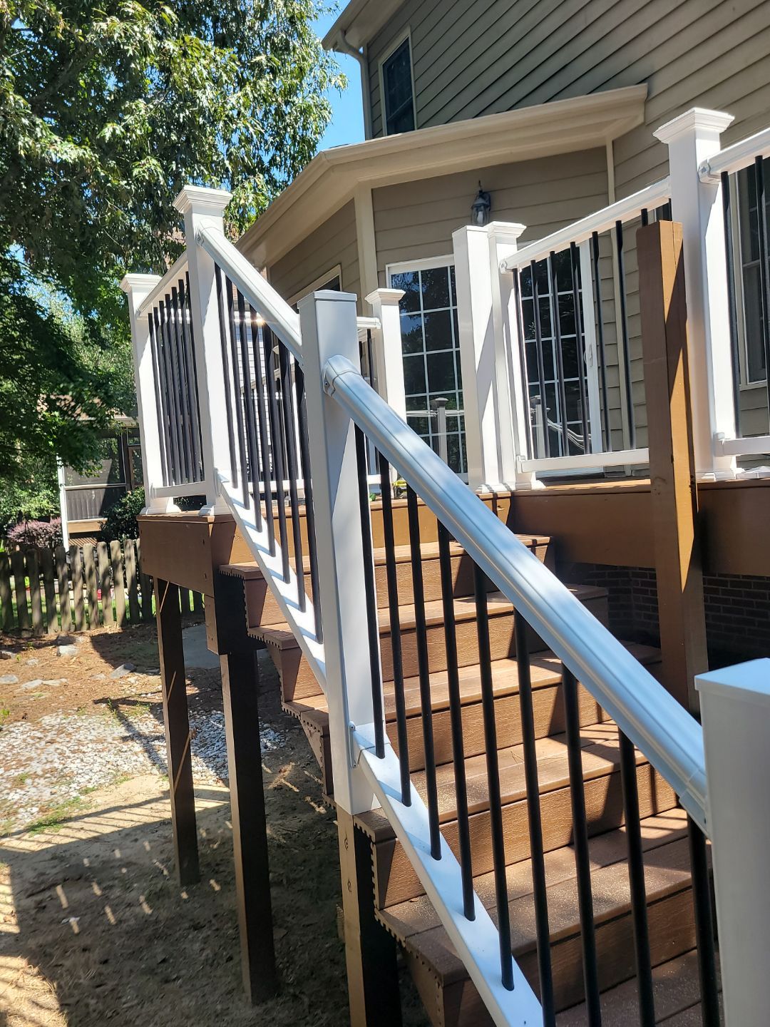 Fuquay-Varina Outdoor Upgrade – Composite Deck & Paved Landing by Elite Remodeling and Design LLC