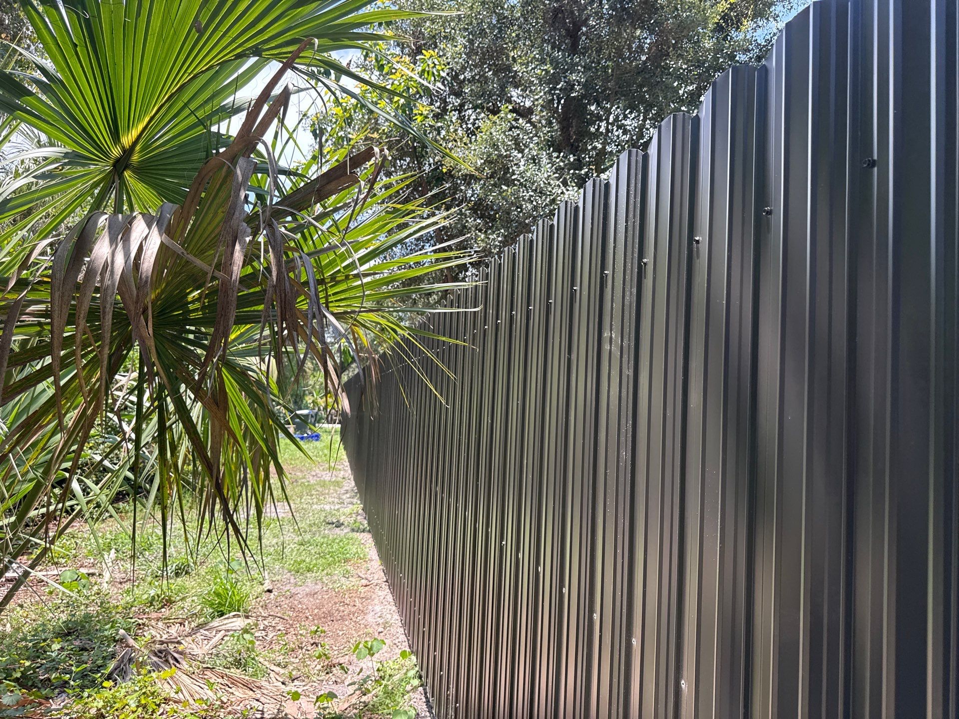 Bronze Scalloped Metal Privacy Fence Installation in North Port by True Fence LLC