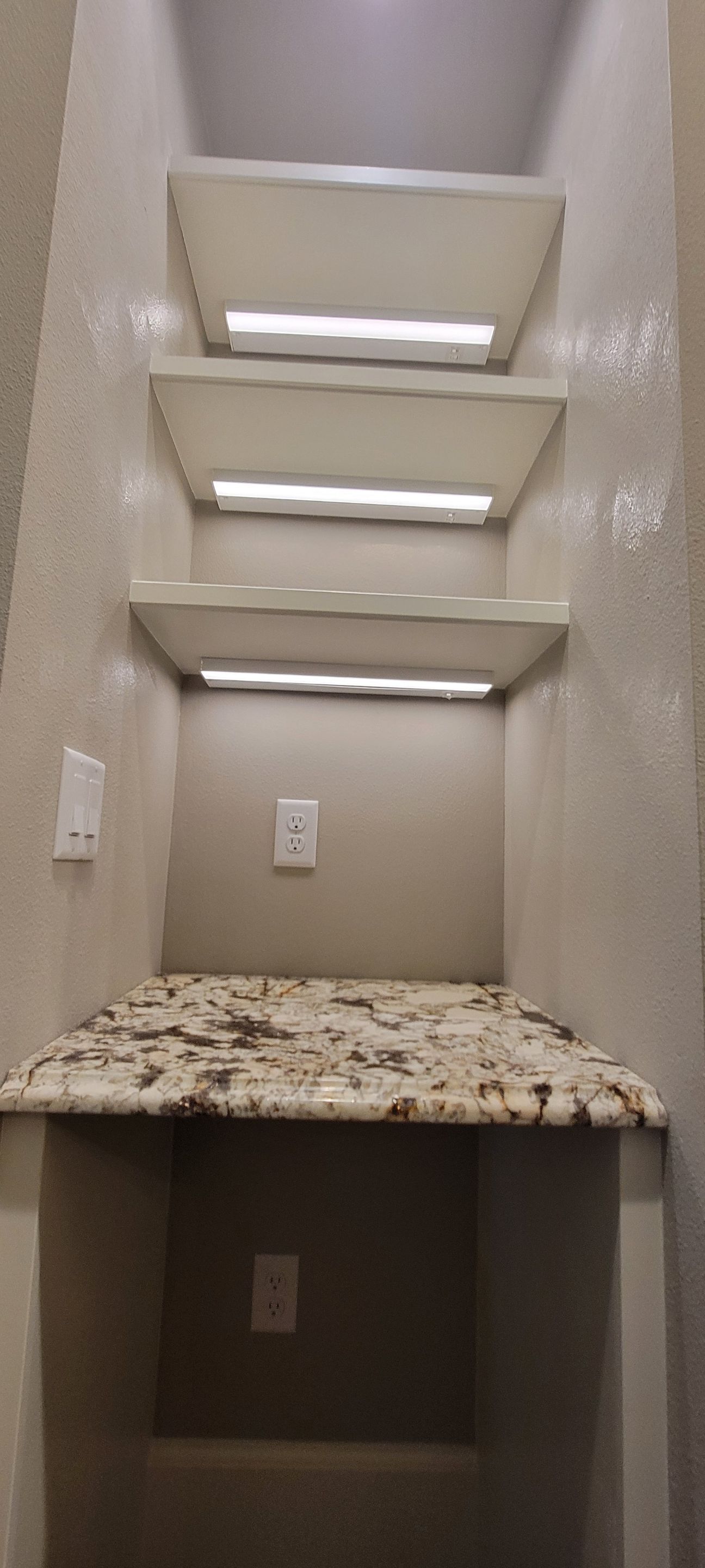 Closet transformation to coffee nook with custom shelves and LED lighting. by Crm Services Llc
