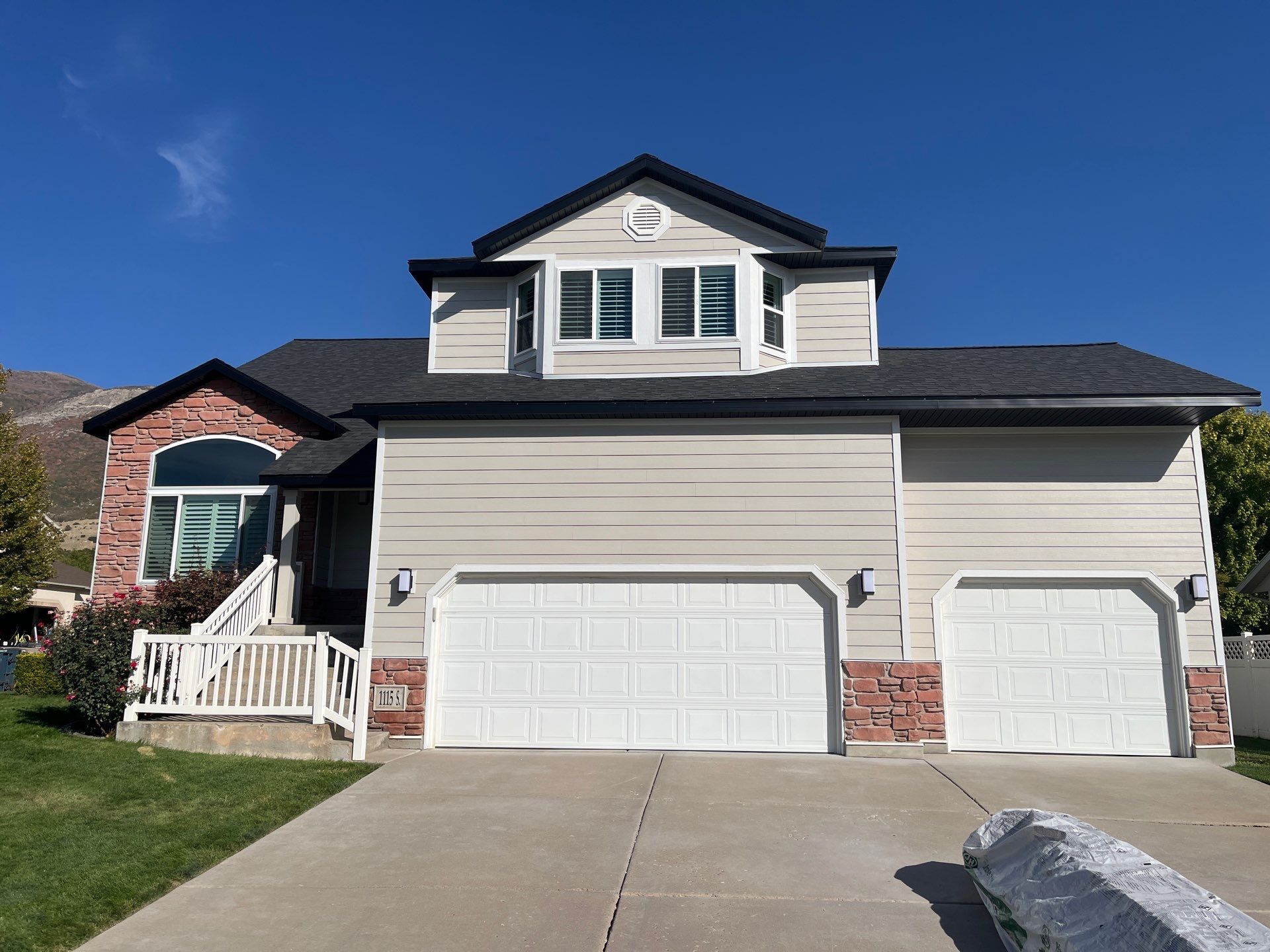 Farmington | Stucco/Vinyl Demo & Hardie Conversion | Cobble Stone & Black by Ideal Siding Utah