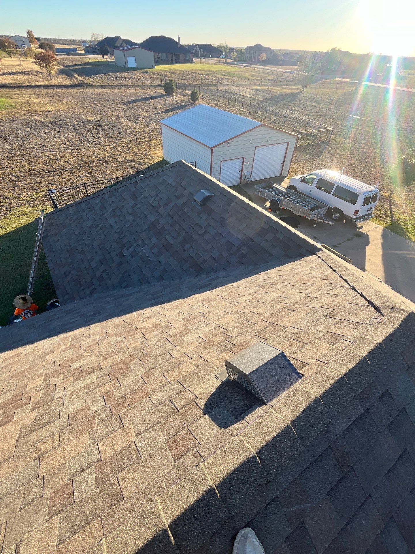 Brick with Malarkey Natural Wood by Tejas Roofworks + Restoration