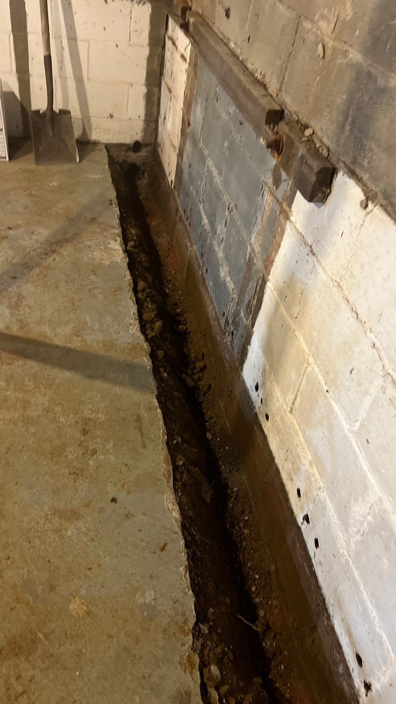 Basement Waterproofing using Drain tile system and a foundation wrap by ACE Waterproofing & Basement Solutions