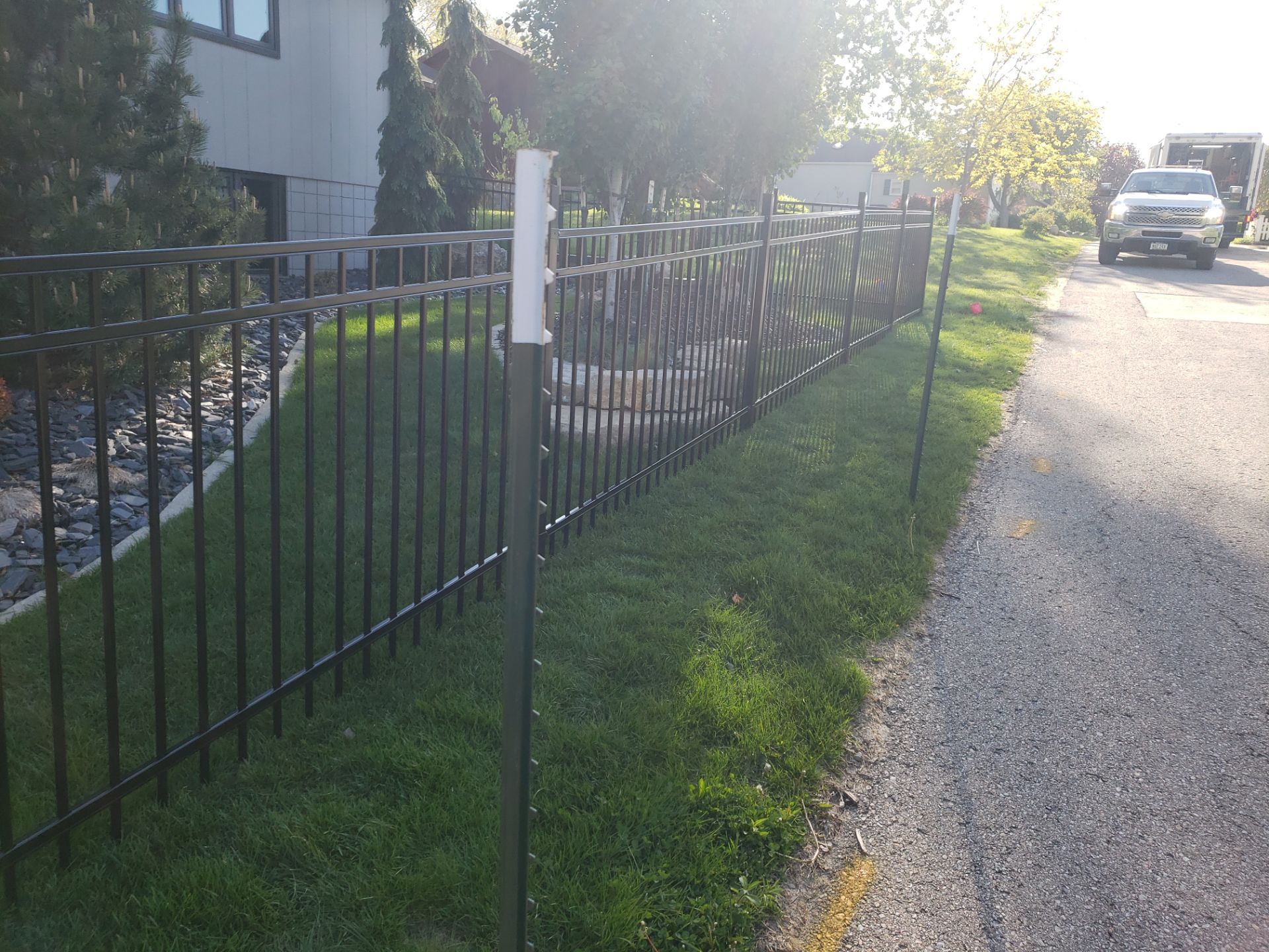 Ornamental Black Metal Picket Fence Installation in Cedar Falls by Perfect Picket Fence and Stain