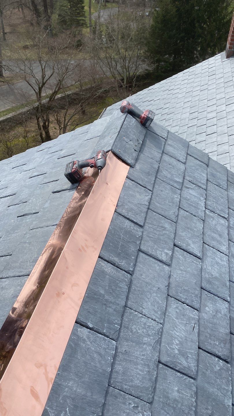 Residential Roofing Installation using Vermont Slate by A Plus Exterior