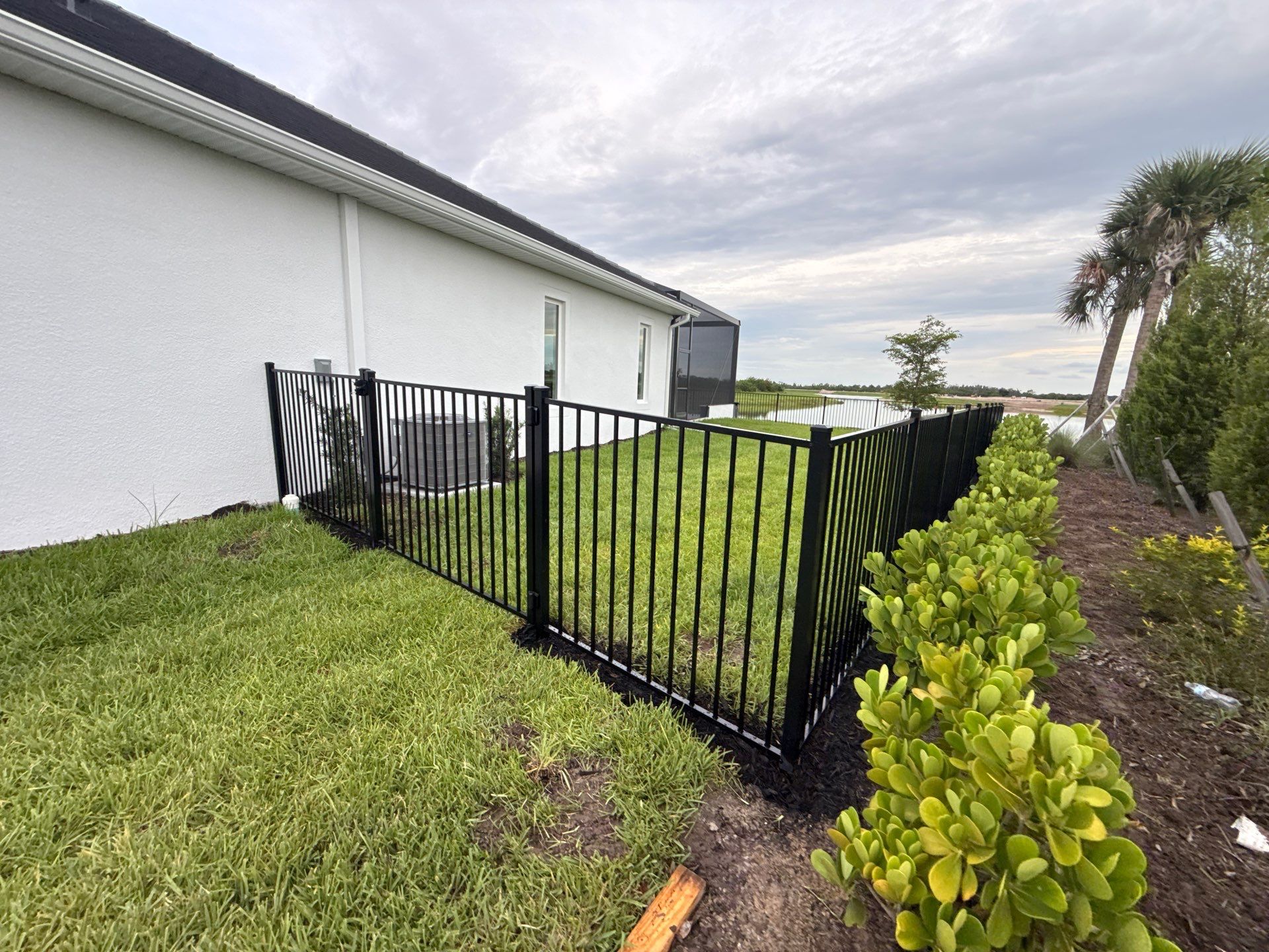 Black Aluminum Picket Fence Installation in Venice, Florida by True Fence LLC