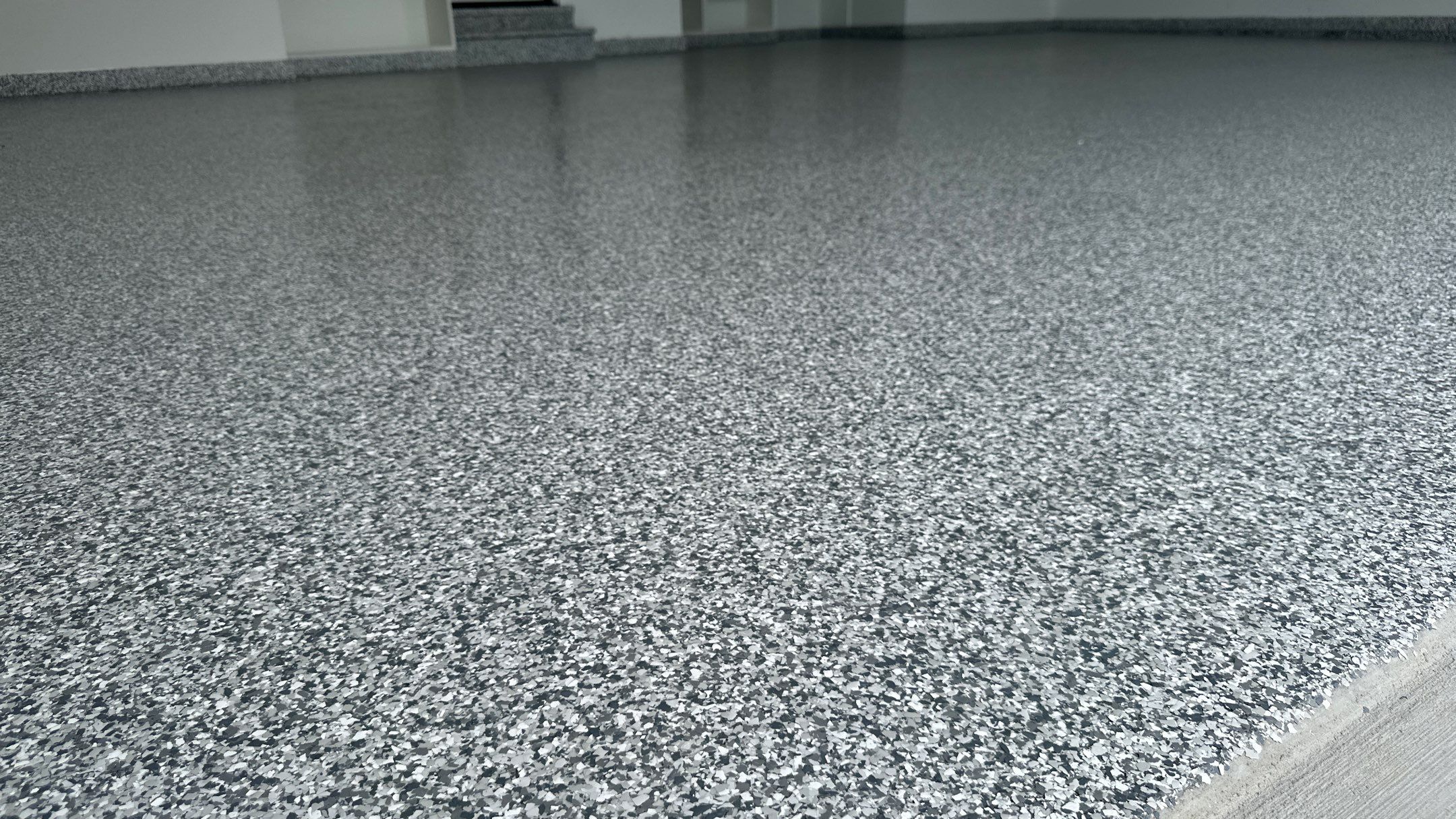 Stonhenge flake floors just look great. Wow!!! by Banner Garage