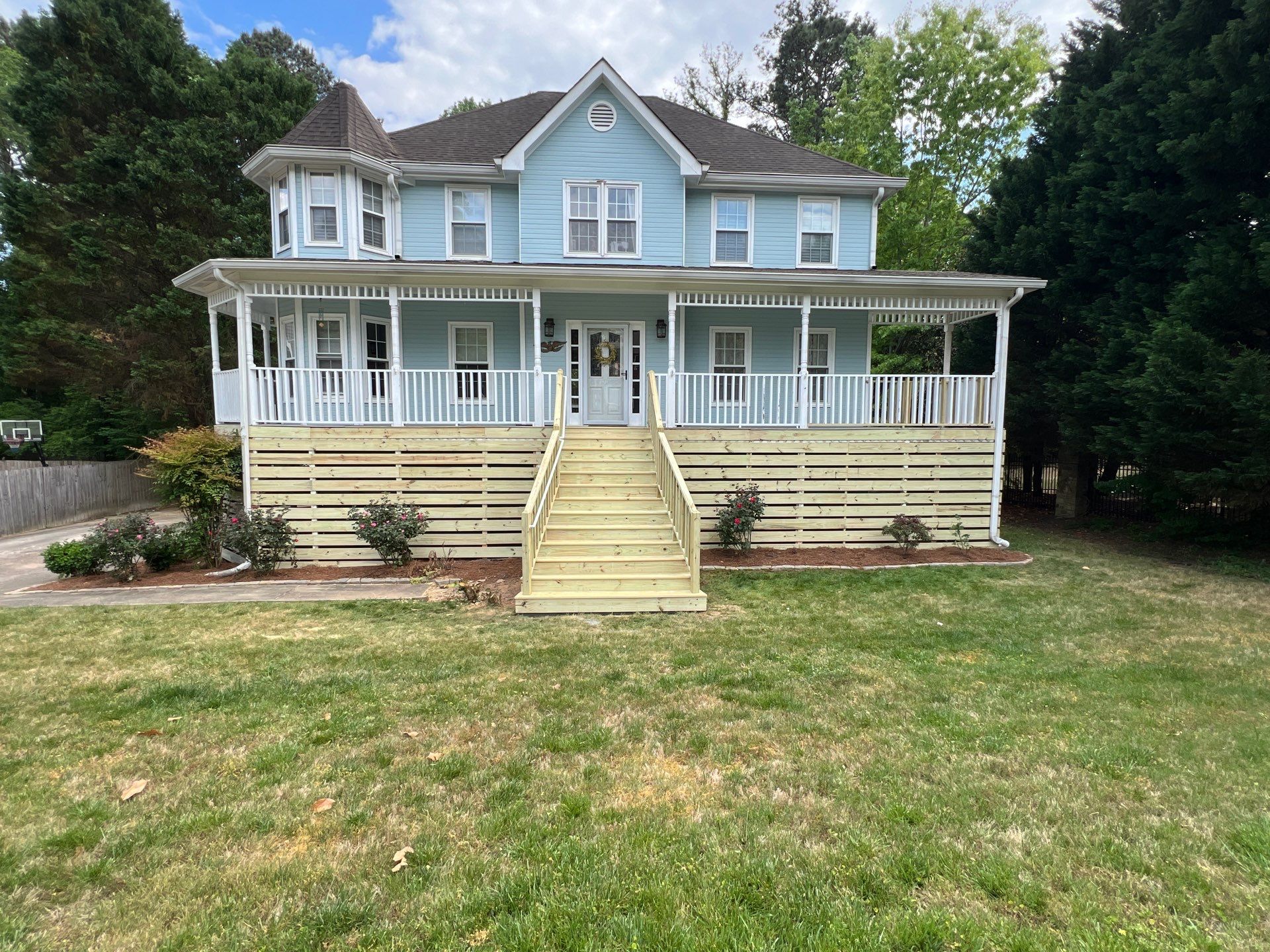 Marietta Porch Upgrade with Horizontal Pressure-Treated Wood Slats by Swift Home Renovations