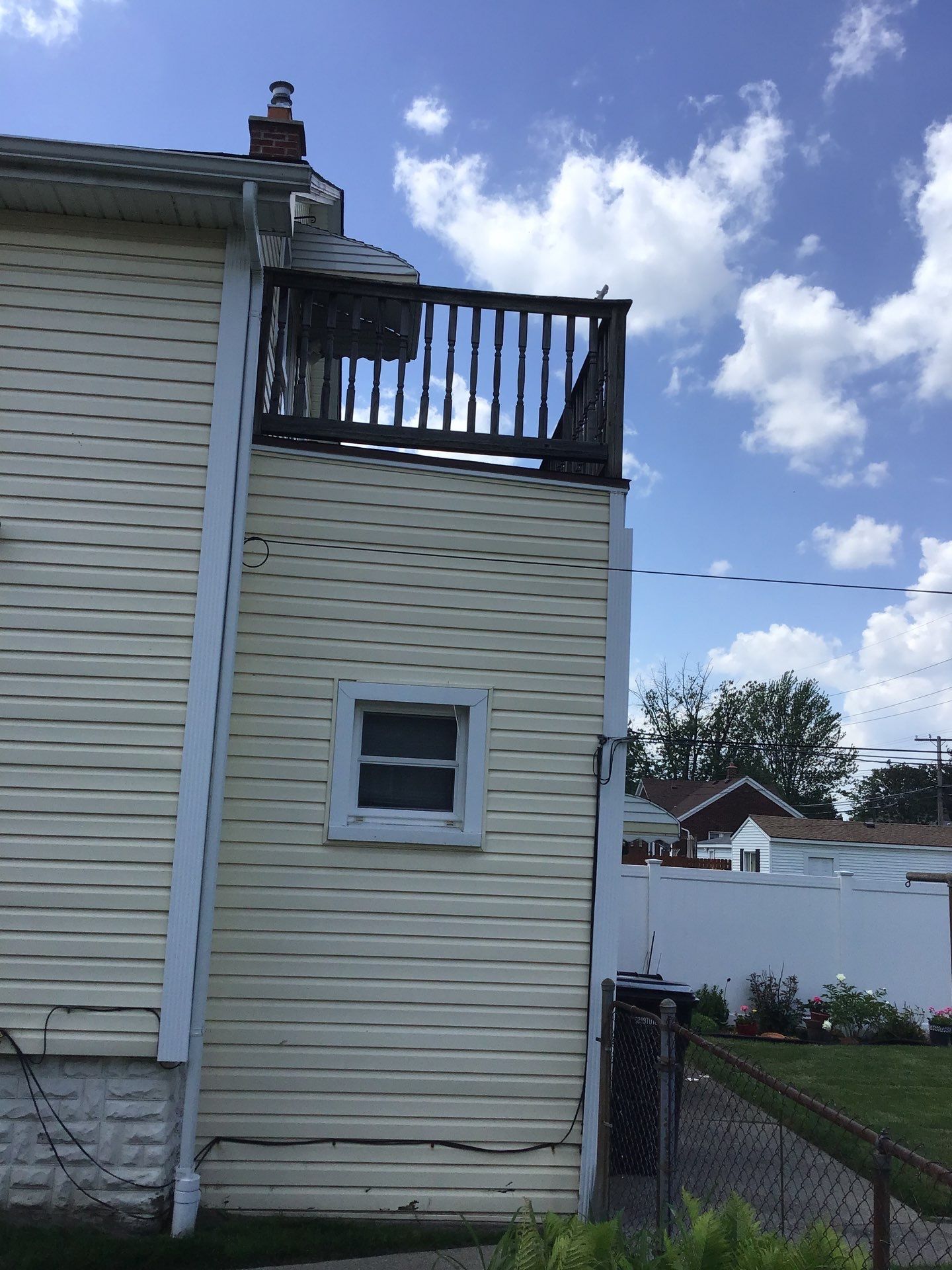 Rebuild balcony flat roofing TREX decking stairway and Railings in Wyandotte, MI by Northwest Construction 