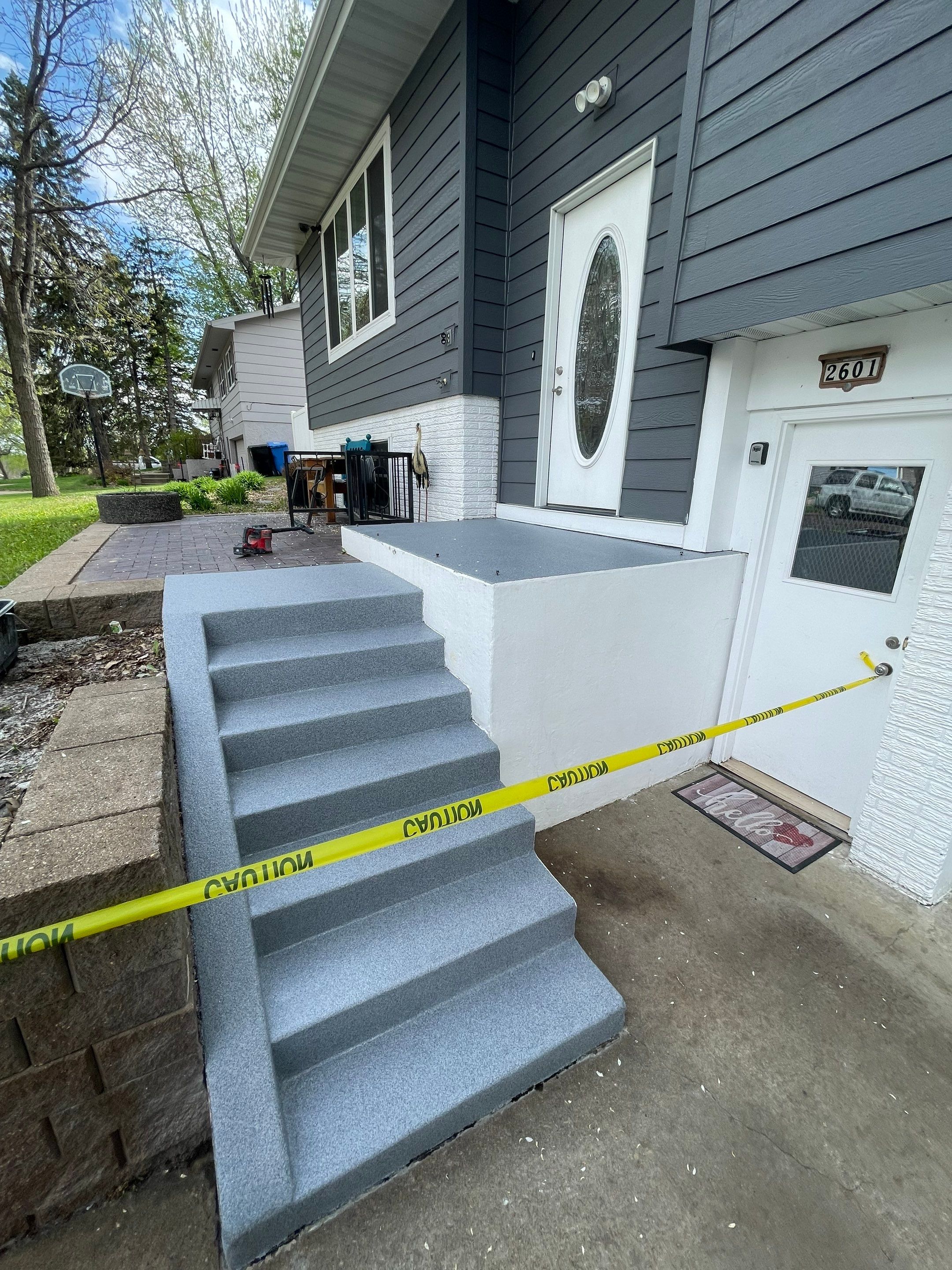 Grey Polyaspartic Porch and Stair Resurfacing in Sioux Falls by Select Painting, Coatings & Garage Cabinets