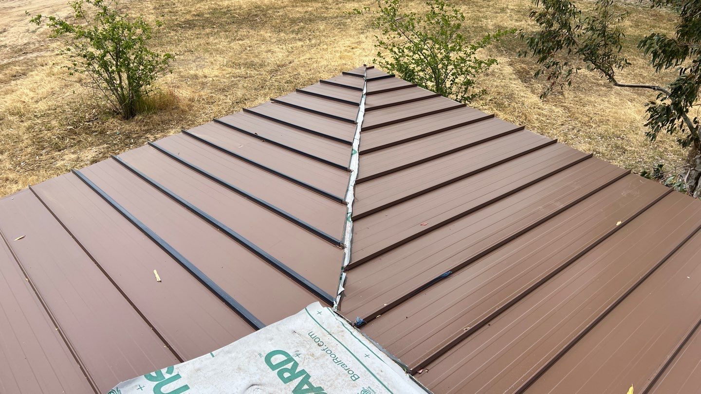 Metal roofing installation using Standing seam metal roofing system by Straight Edge Roofing Inc