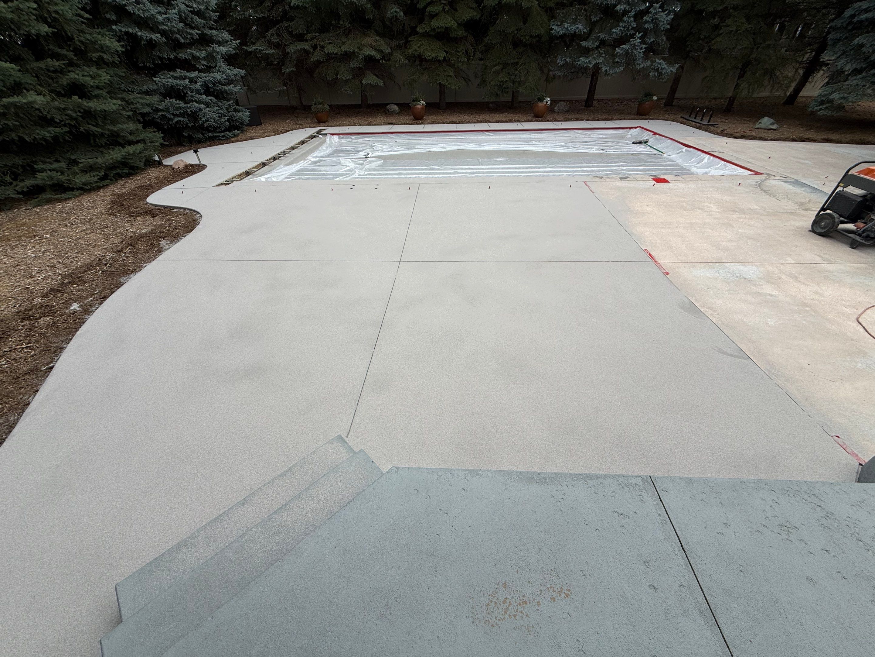 Decorative Concrete Pool Deck and Patio Resurfacing in Sioux Falls by Select Painting, Coatings & Garage Cabinets
